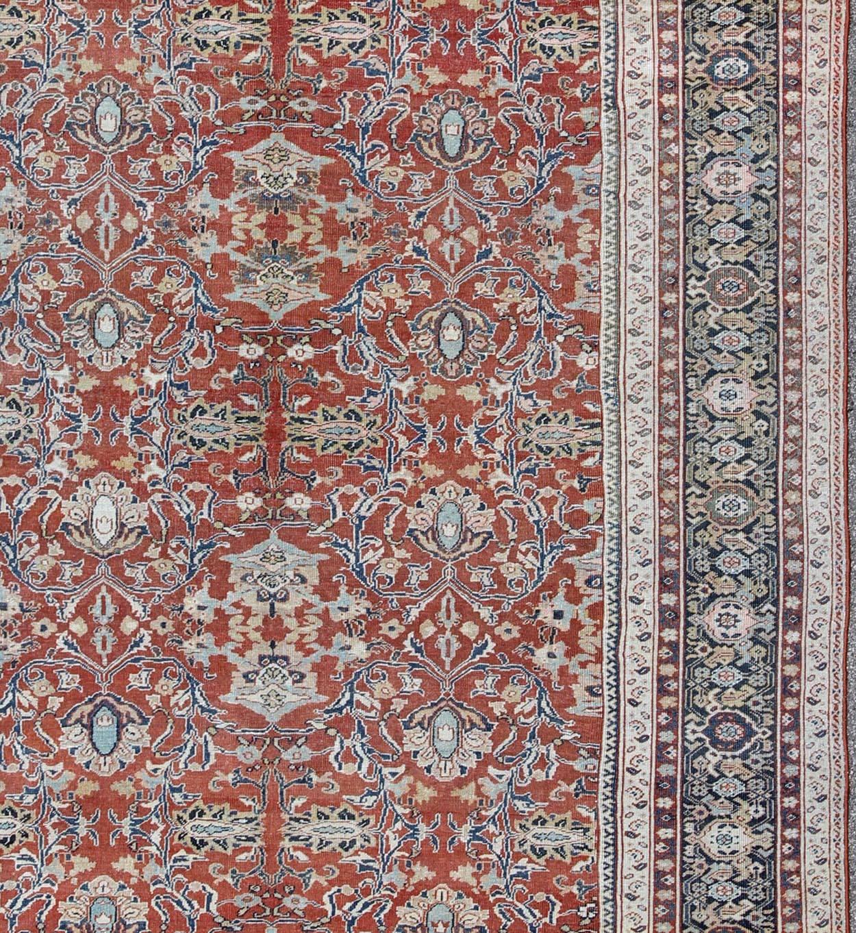 Hand-Knotted Antique Sultanabad Rug with Large Flower Design in Soft Red Field & Multi Colors For Sale