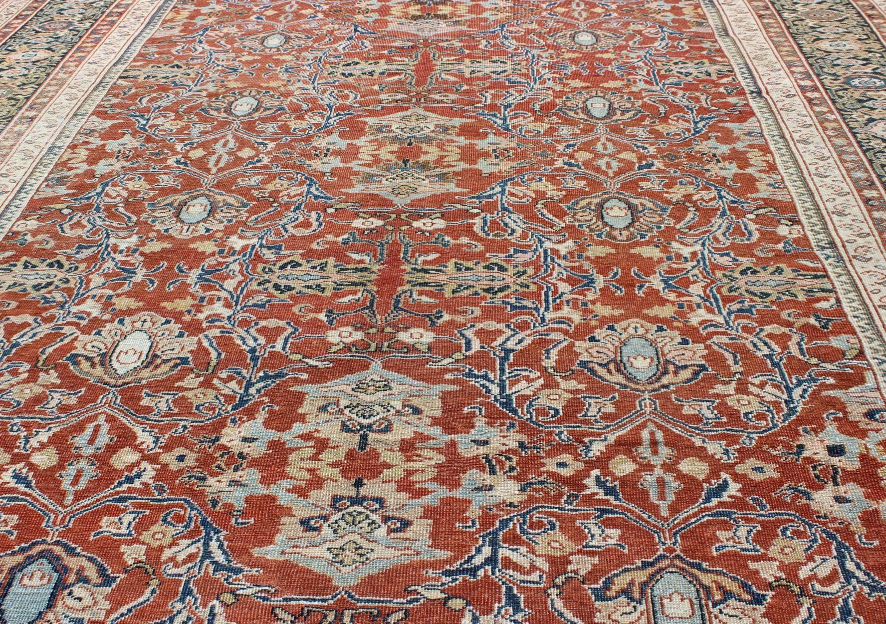 Early 20th Century Antique Sultanabad Rug with Large Flower Design in Soft Red Field & Multi Colors For Sale