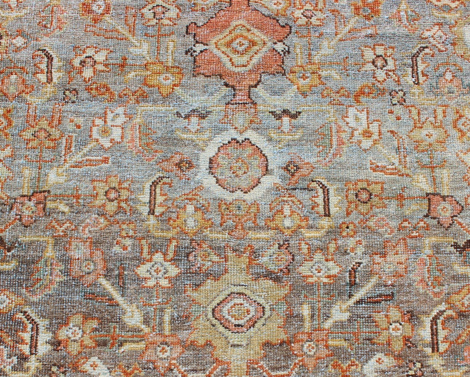 Wool Antique Sultanabad with Muted Background and Hints of Red and Orange For Sale