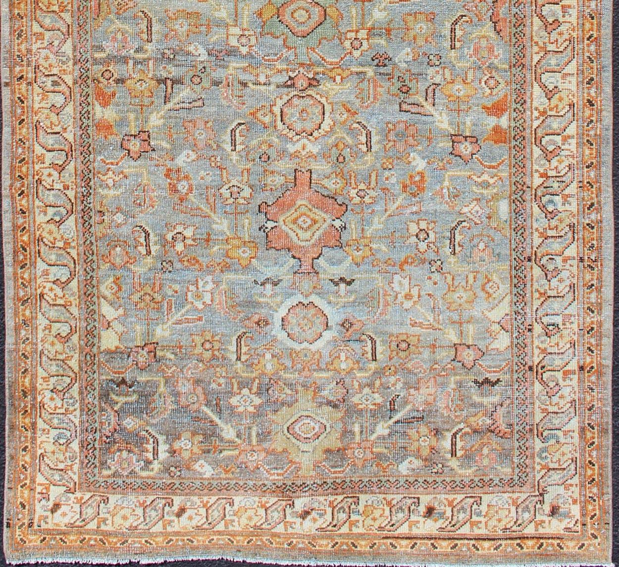 Persian Sultanabad antique rug with floral design in gray, green, blue, and red colors with all-over pattern, rug SUS-2002-642, country of origin / type: Iran / Sultanabad circa 1900.

This antique Persian Sultanabad rug, circa early 20th century,