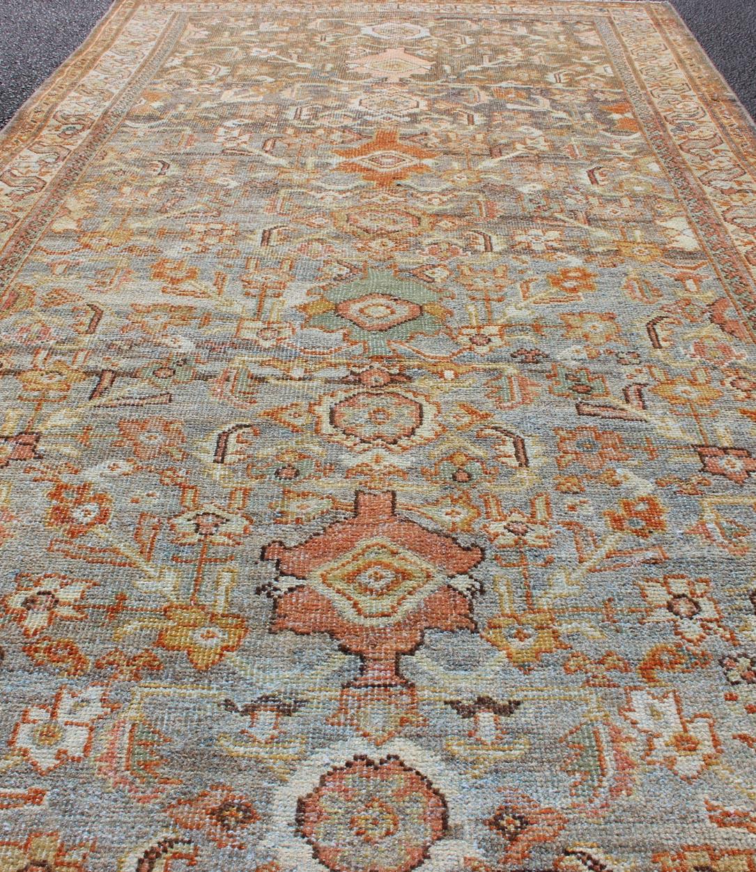 Hand-Knotted Antique Sultanabad with Muted Background and Hints of Red and Orange For Sale