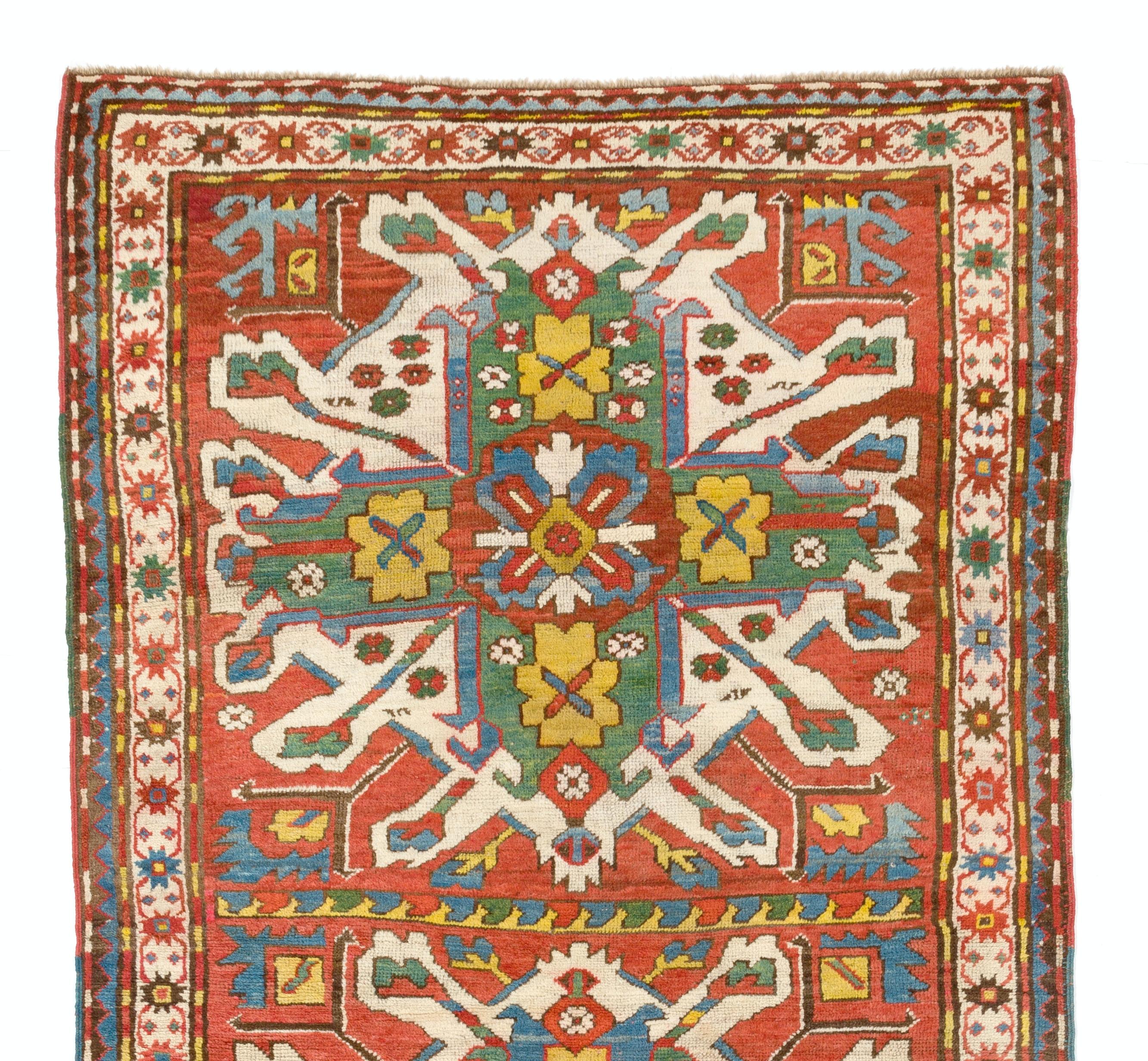 A splendid antique Caucasian rug from the village of Chelaberd in Southern Karabagh. This highly popular so called sunburst or Eagle Kazak design rugs are some of the most collectible and sought after ones among all antique Caucasian works of