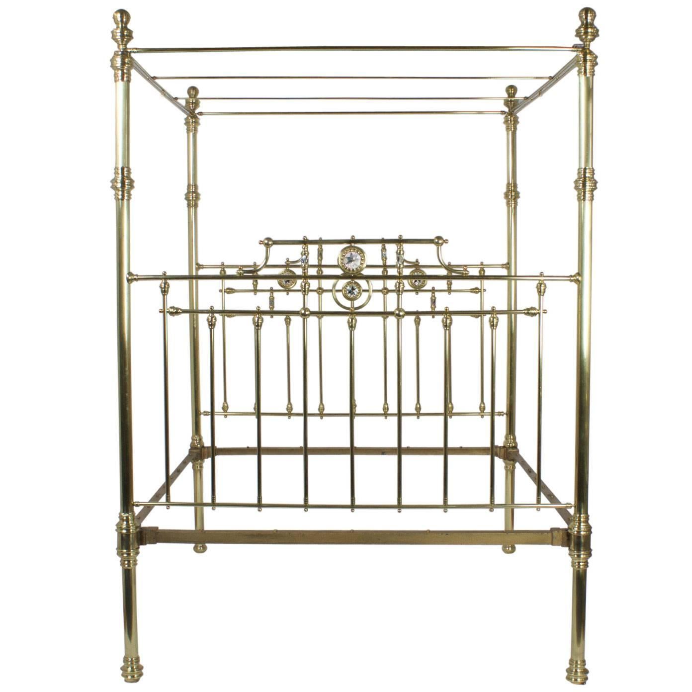 Inspired, bold antique super queen size English brass bed or daybed with an optional side panel. This luxurious bed features side curtain rods, mother of pearl medallions on the head and foot board, and over a century of history. Hand polished and