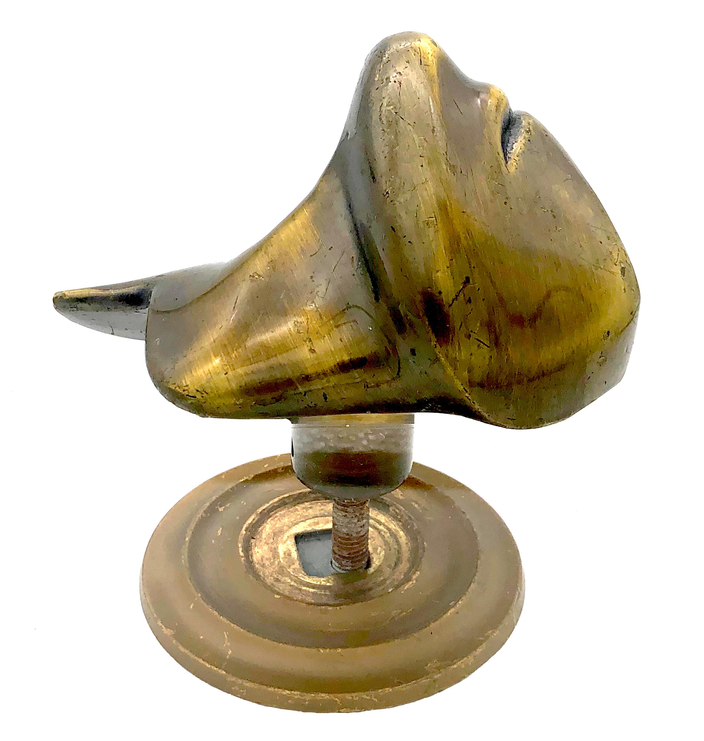 This extraordinary sculpture of the lower part of a face with a neck is a solid bronze cast with a beautiful patina. It is mounted as a door handle. The sculpture was found in Brussels and belonged to an antique dealers collection. 
Surrealist