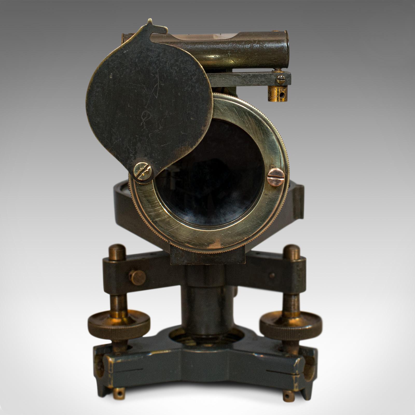 This is an antique surveyor's level. An English, brass theodolite desk ornament by William Stanley with mahogany carry box, dating to the early 20th century, circa 1910.

A Fine scientific instrument from a renowned designer
Displays a desirable