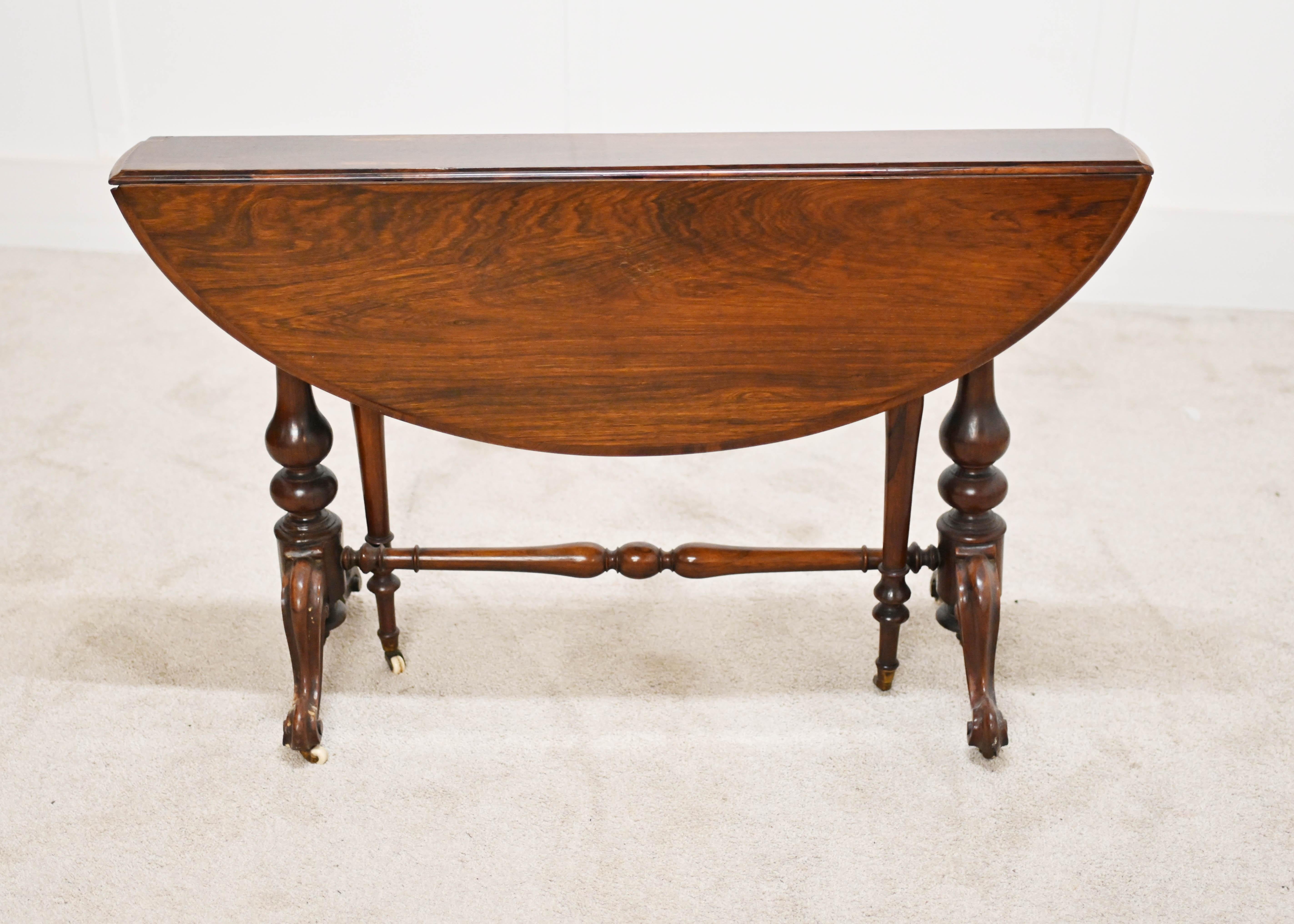 A gorgeous Sutherland table with a drop leaf stretchers base with 4 carved legs
Circa 1880
Hand crafted from mahogany Sutherland Tables are a 19th Century Victorian invention of a much smaller gateleg table design 
The design was first created in
