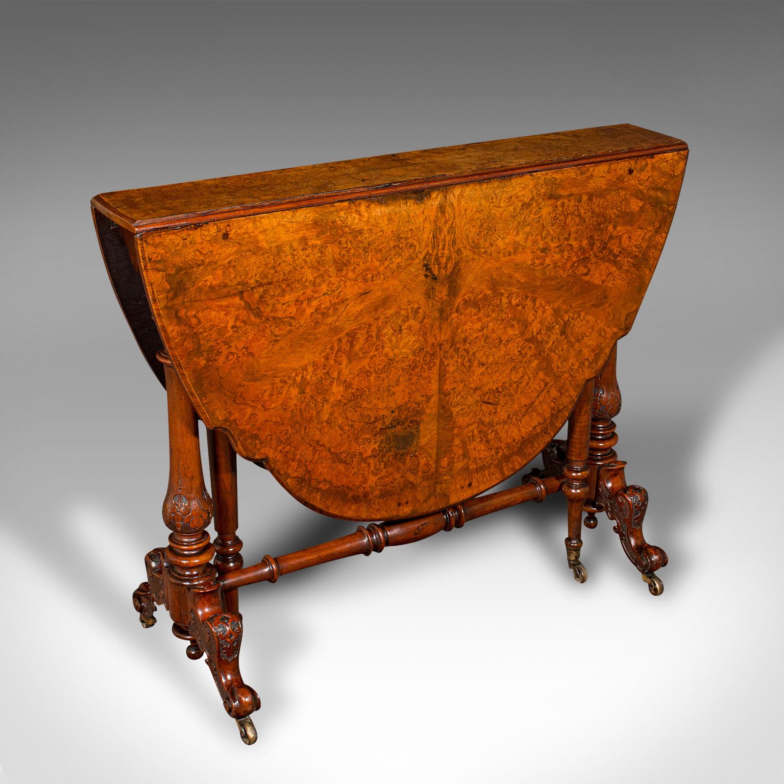 This is an antique Sutherland table. An English, burr walnut gate-leg 4-seat occasional table, dating to the early Victorian period, circa 1840.

Impressively figured oval table in the traditional Sutherland form
Displays a desirable aged patina and