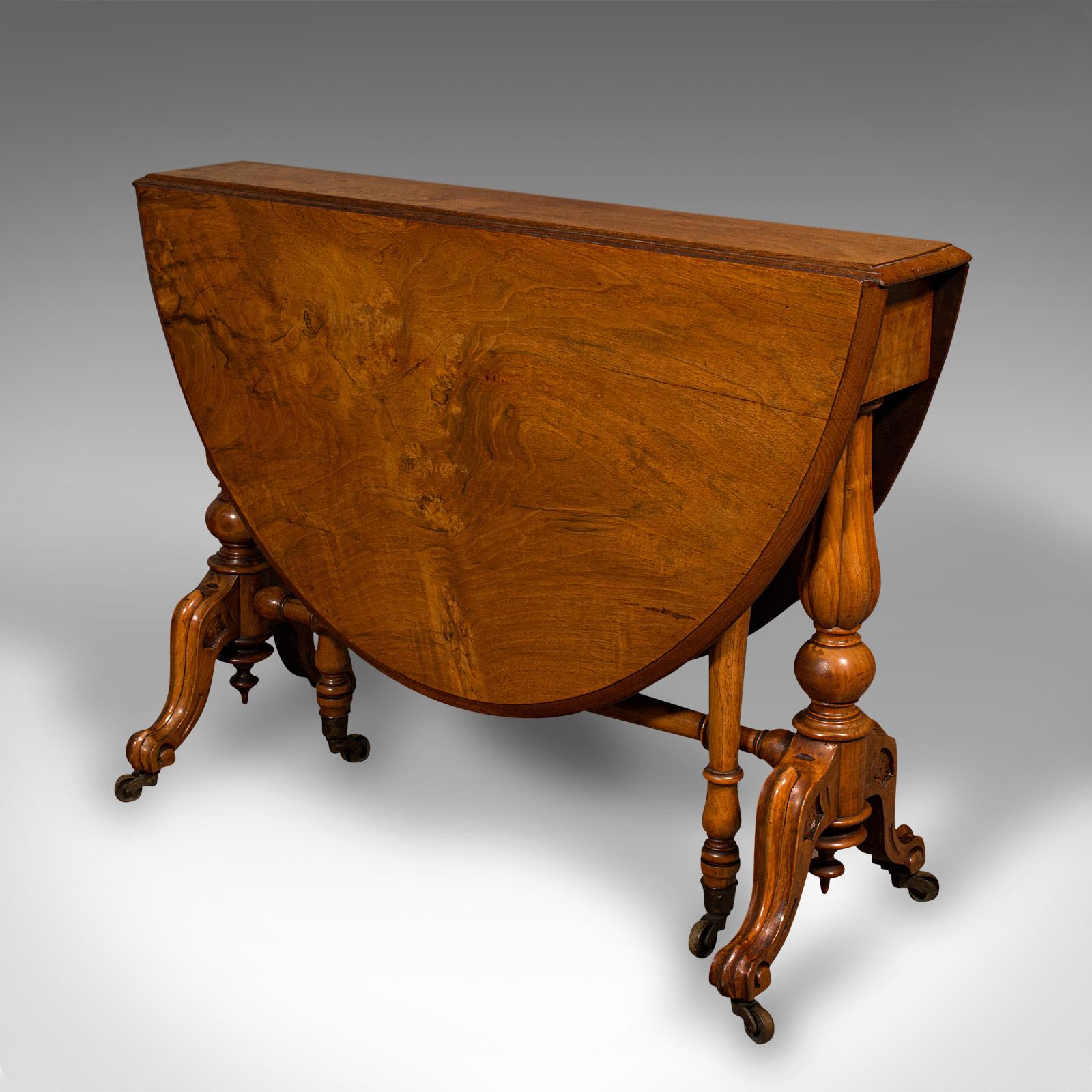 This is an antique Sutherland table. An English, burr walnut gate-leg oval occasional table, dating to the early Victorian period, circa 1850.

Rich in colour and exuding fine craftsmanship
Displays a desirable aged patina and in very good