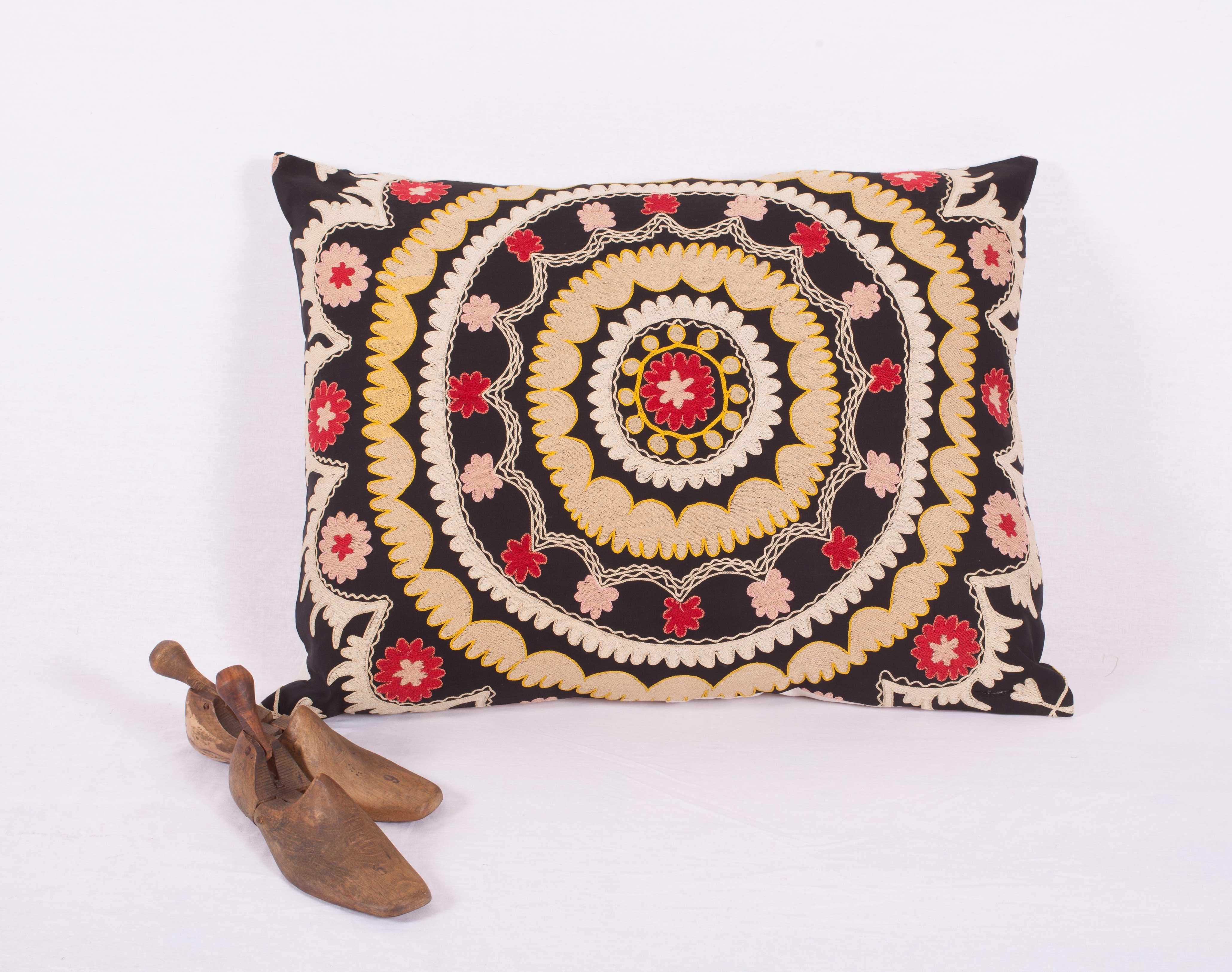 The pillow is made from an old Uzbek Samarkand Suzani. It does not come with an insert but comes with a bag made to the size and out of cotton to accommodate the filling. The backing is made of linen. Please note filling is not provided. Since the