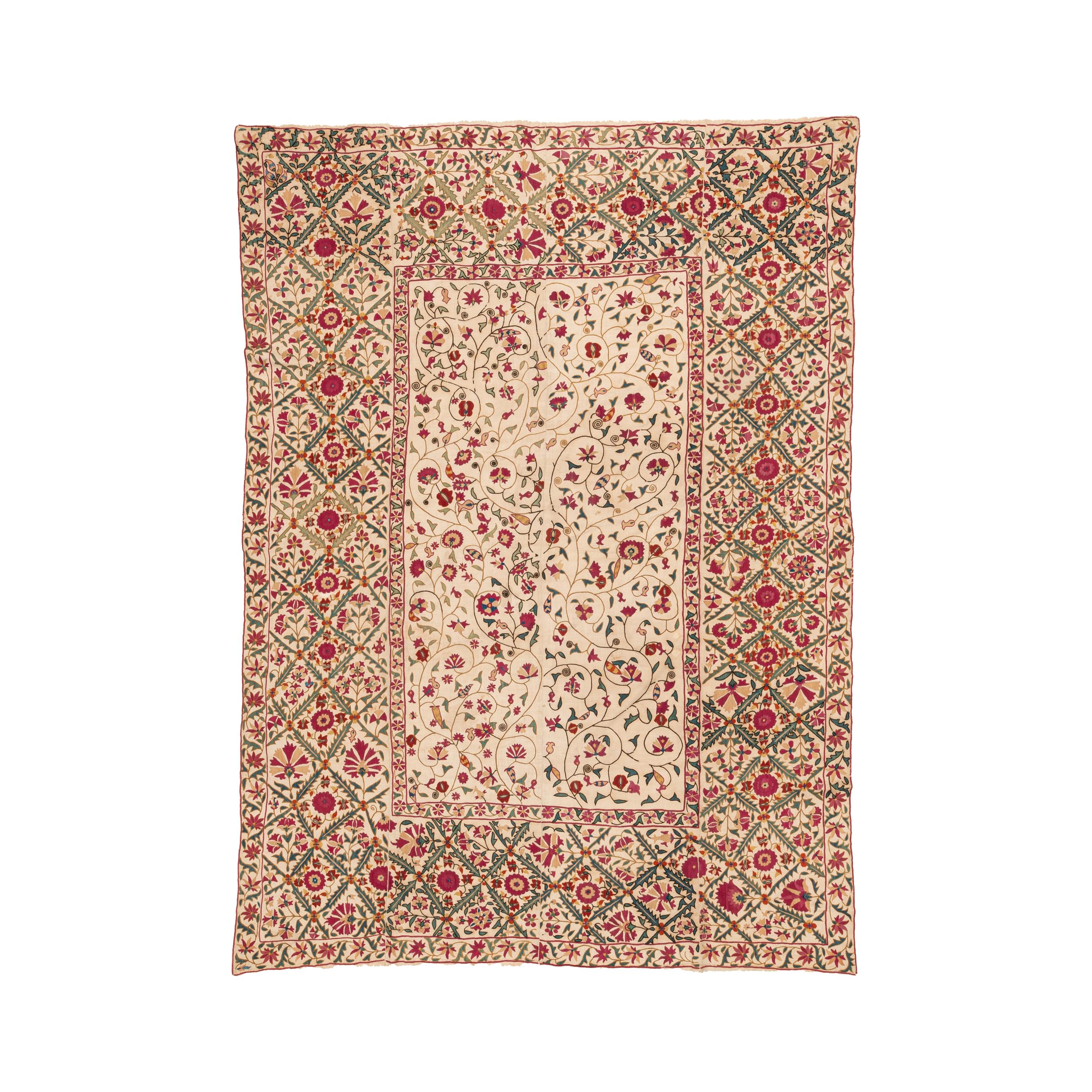 A rather unusual suzani dating back to 19th C from Ura Tune of Tajikistan. 
It is in good condtion except the traces of use and age. It was relined with plain cotton.