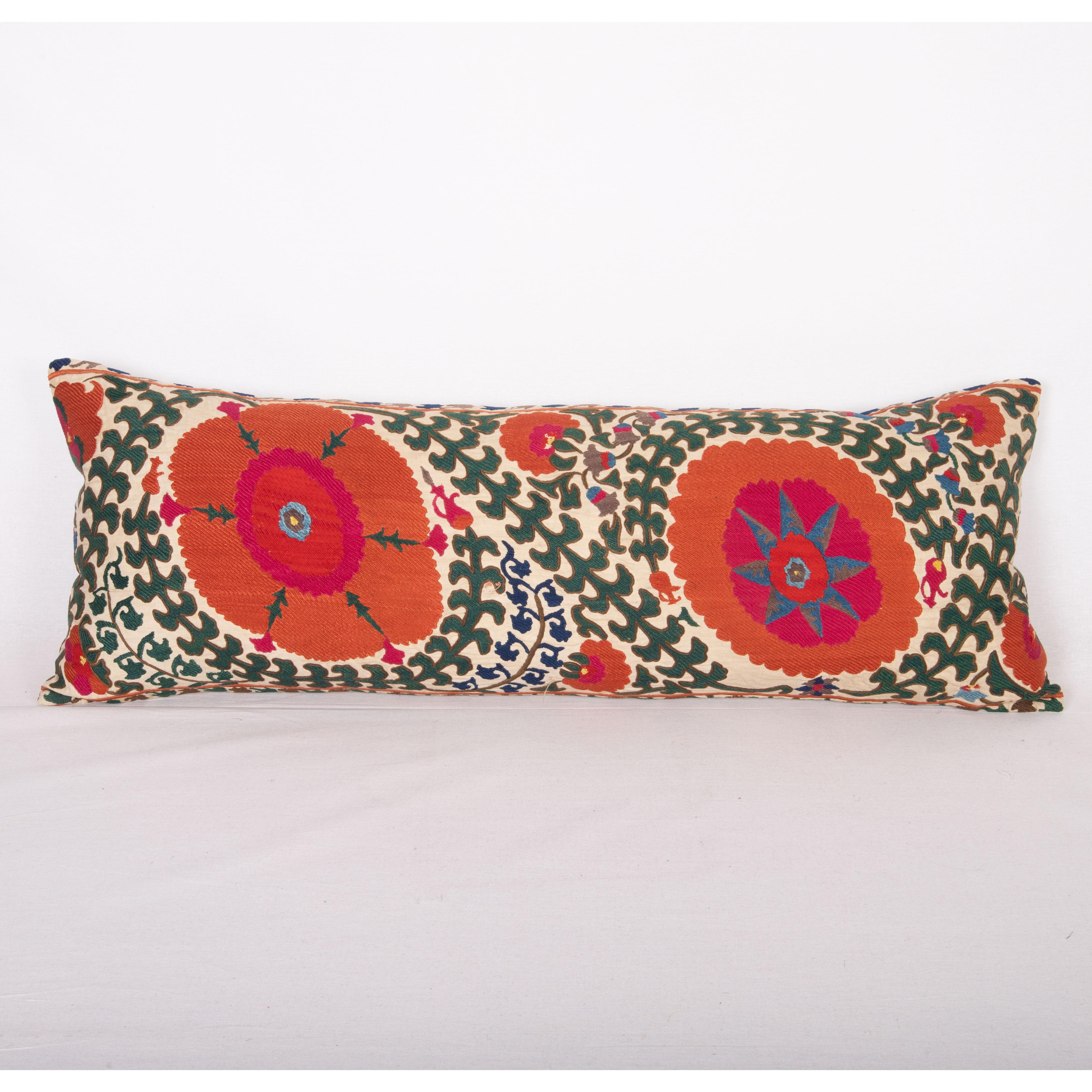This suzani pillow is made from a mid-19th C. Suzani from Bukhara Uzbekistan.

It does not come with an insert but a bag made to the size to accommodate insert materials.
Linen in the back.
Zipper closure.
Dry cleaning is reccommended.
 