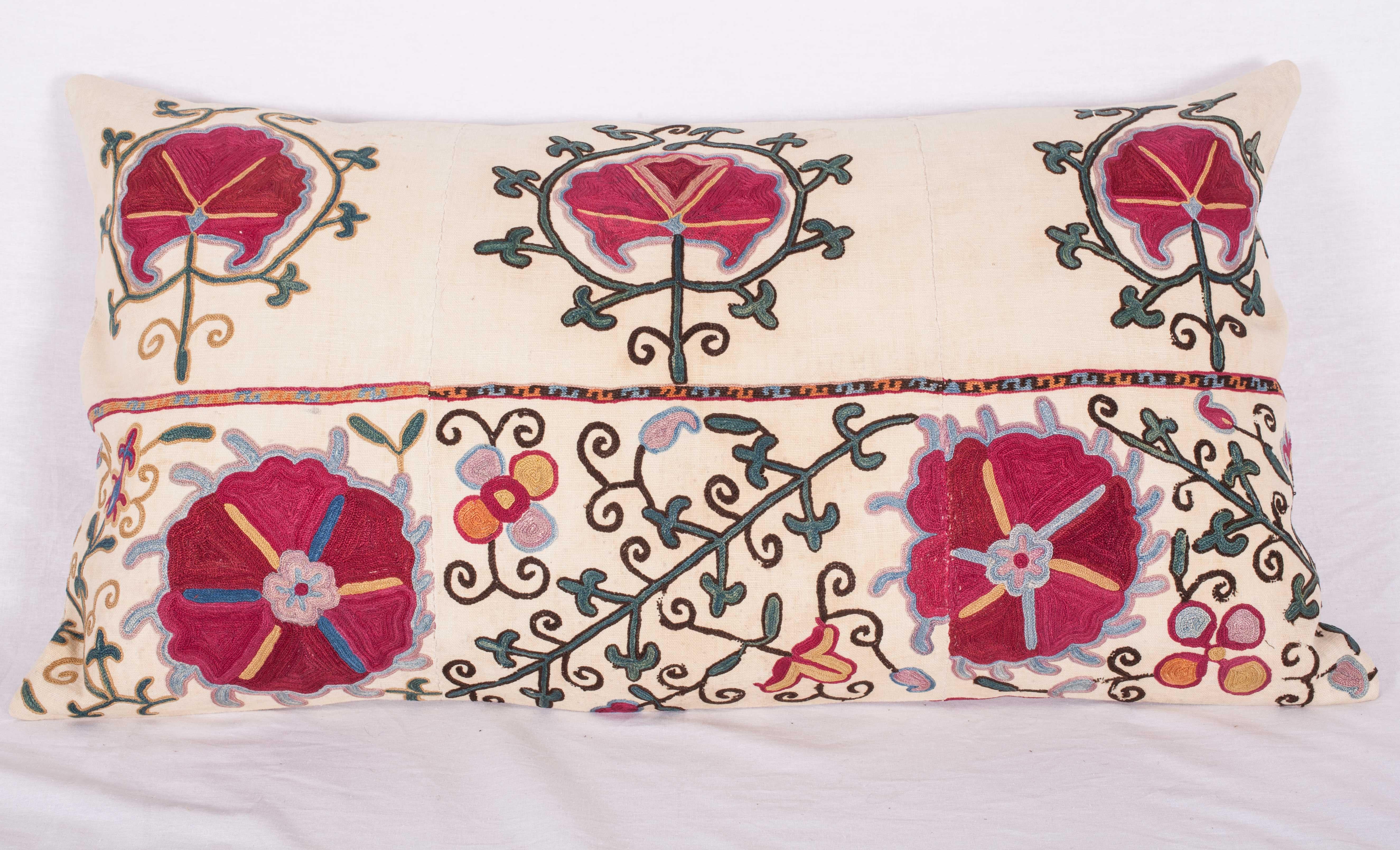 The pillow case is made from an antique Uzbek Suzani from Bukhara. It is silk embroidery on a handwoven cotton field. The backing is pure linen, and they do not come with inserts but bags made to the size in cotton to accommodate insert materials.