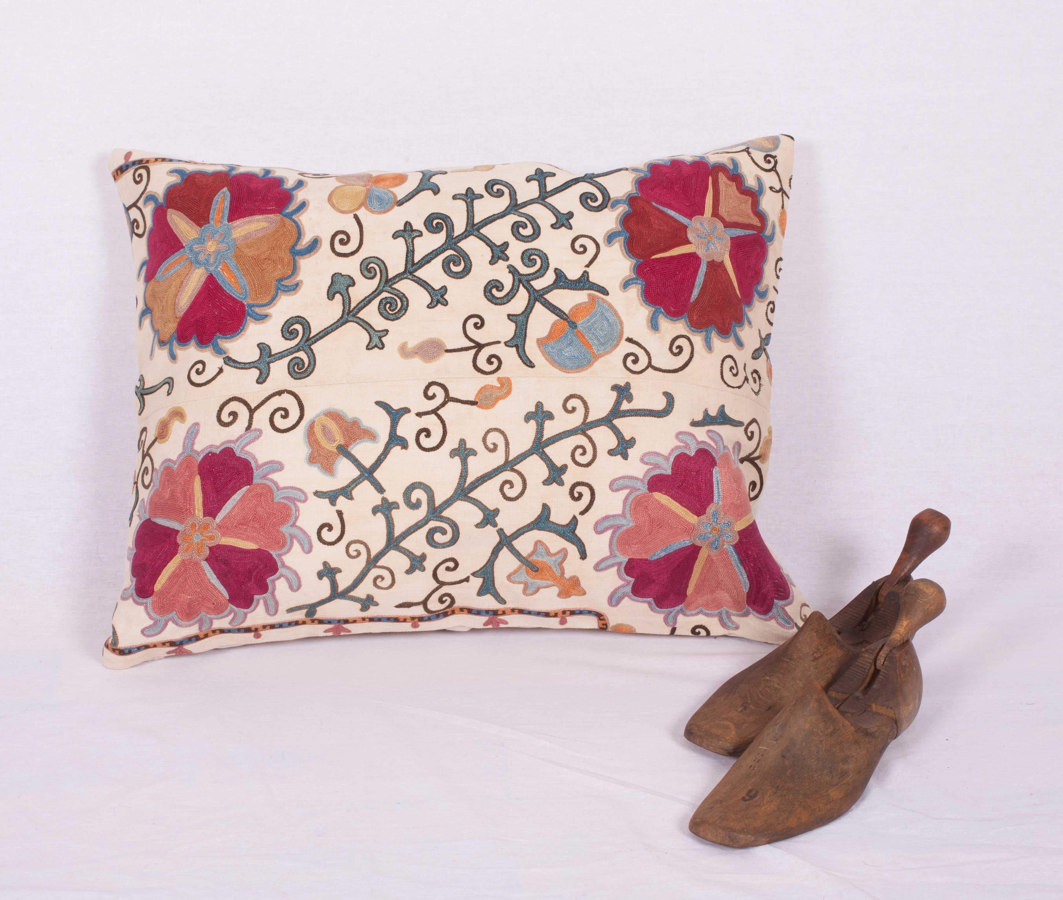 The pillow case is made from an antique Uzbek Suzani from Bukhara. It is silk embroidery on a handwoven cotton field. The backing is pure linen, and they do not come with inserts but bags made to the size in cotton to accommodate insert materials.