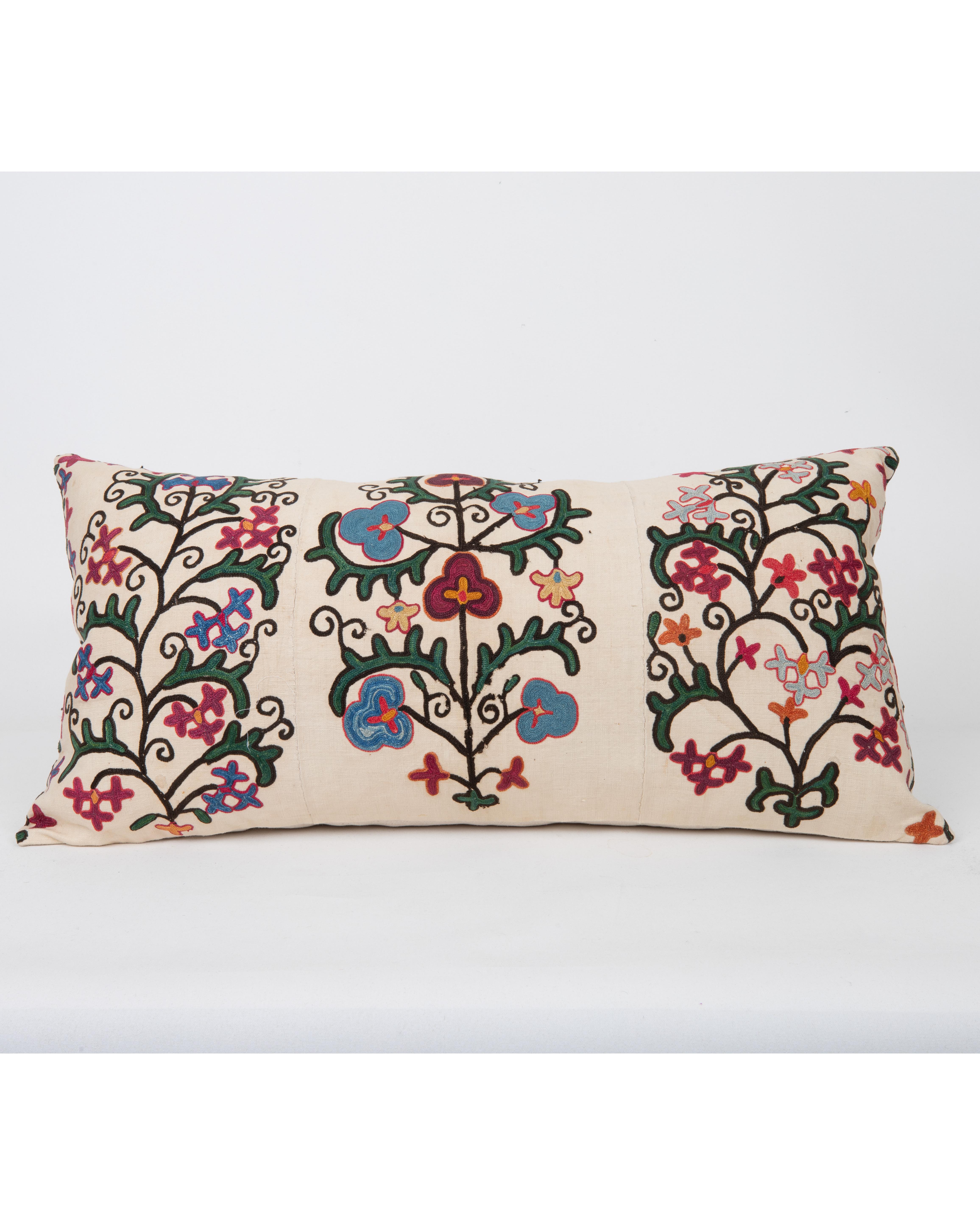 It does not come with an insert.
Linen in the back.
Zipper Closure.
Dry Cleaning recommended.



This  pillow is fashioned from a late 19th -century suzani originating from Bukhara, Uzbekistan—an important Silk Road city celebrated for its masterful