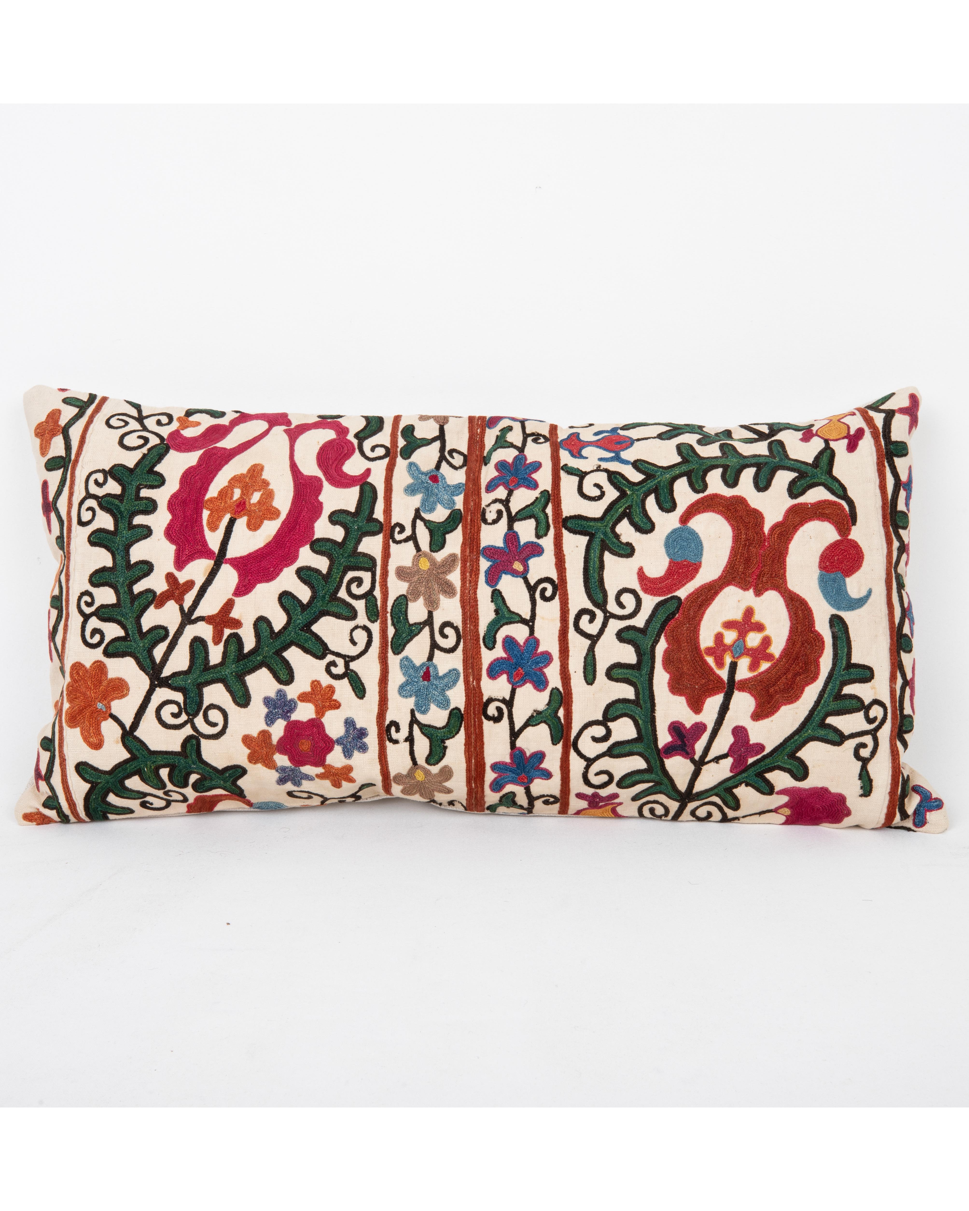 It does not come with an insert.
Linen in the back.
Zipper Closure.
Dry Cleaning recommended.



This  pillow is fashioned from a late 19th -century suzani originating from Bukhara, Uzbekistan—an important Silk Road city celebrated for its masterful