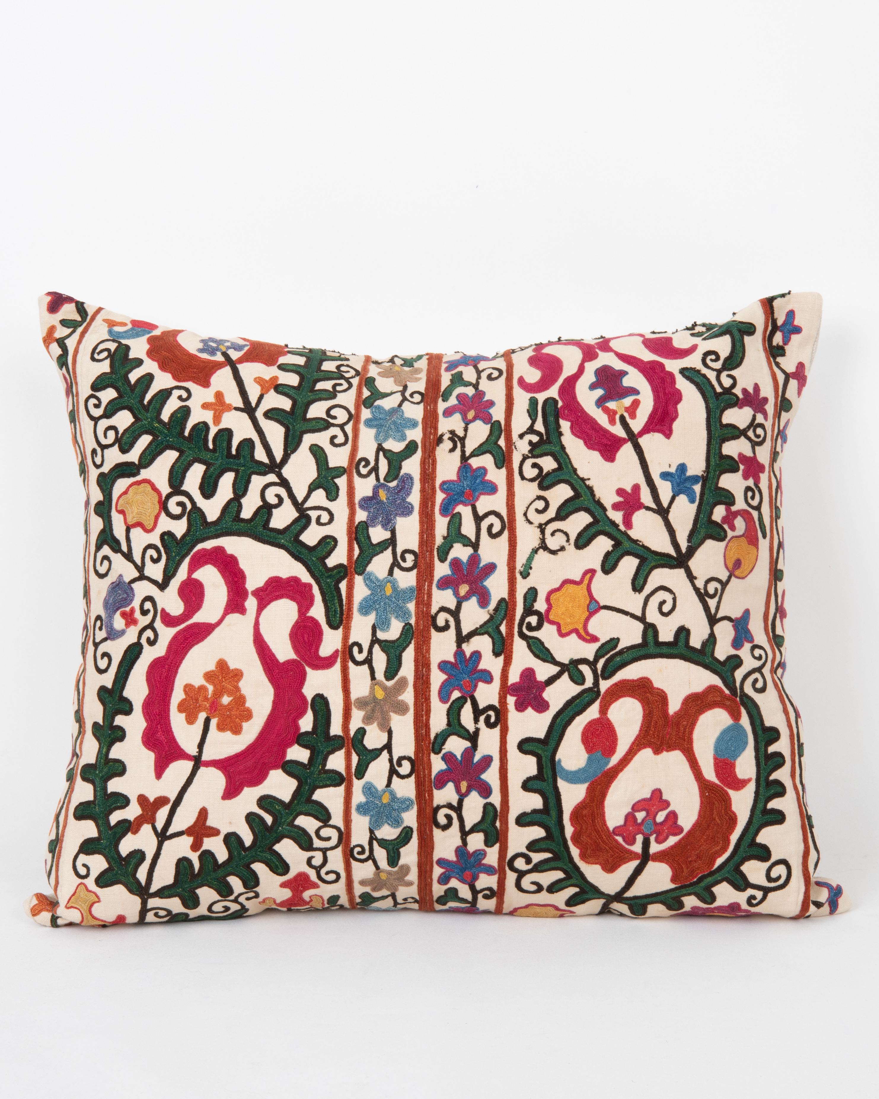 It does not come with an insert.
Linen in the back.
Zipper Closure.
Dry Cleaning recommended.



This  pillow is fashioned from a late 19th -century suzani originating from Bukhara, Uzbekistan—an important Silk Road city celebrated for its masterful