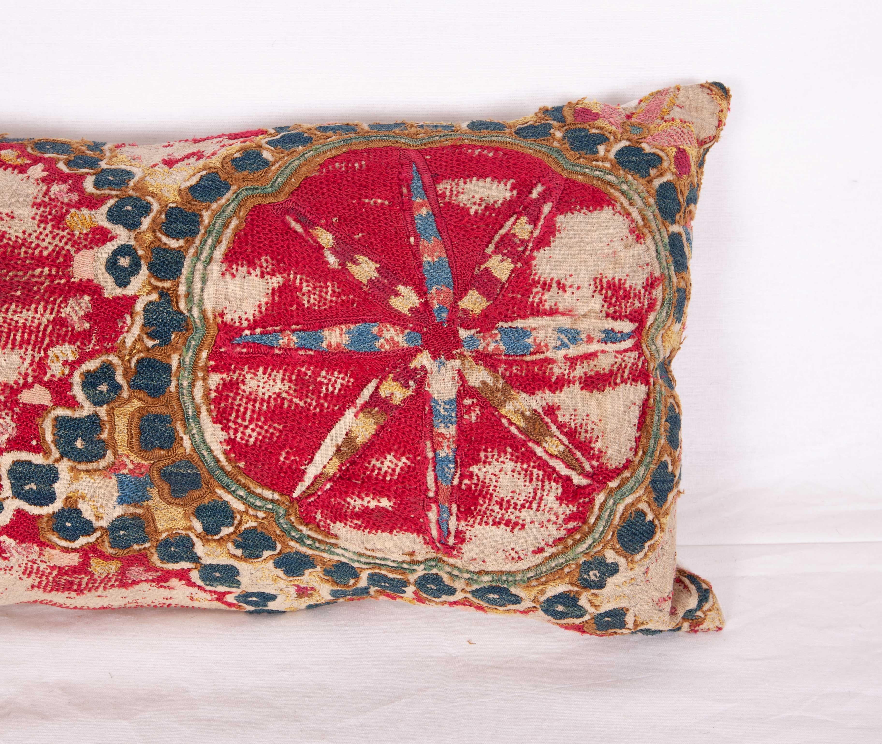 The pillow case is made from an antique Uzbek Suzani from Tashkent. It is silk embroidery on a handwoven cotton field. The backing is pure linen, and it does not come with an insert but bag made to the size in cotton to accommodate insert materials.