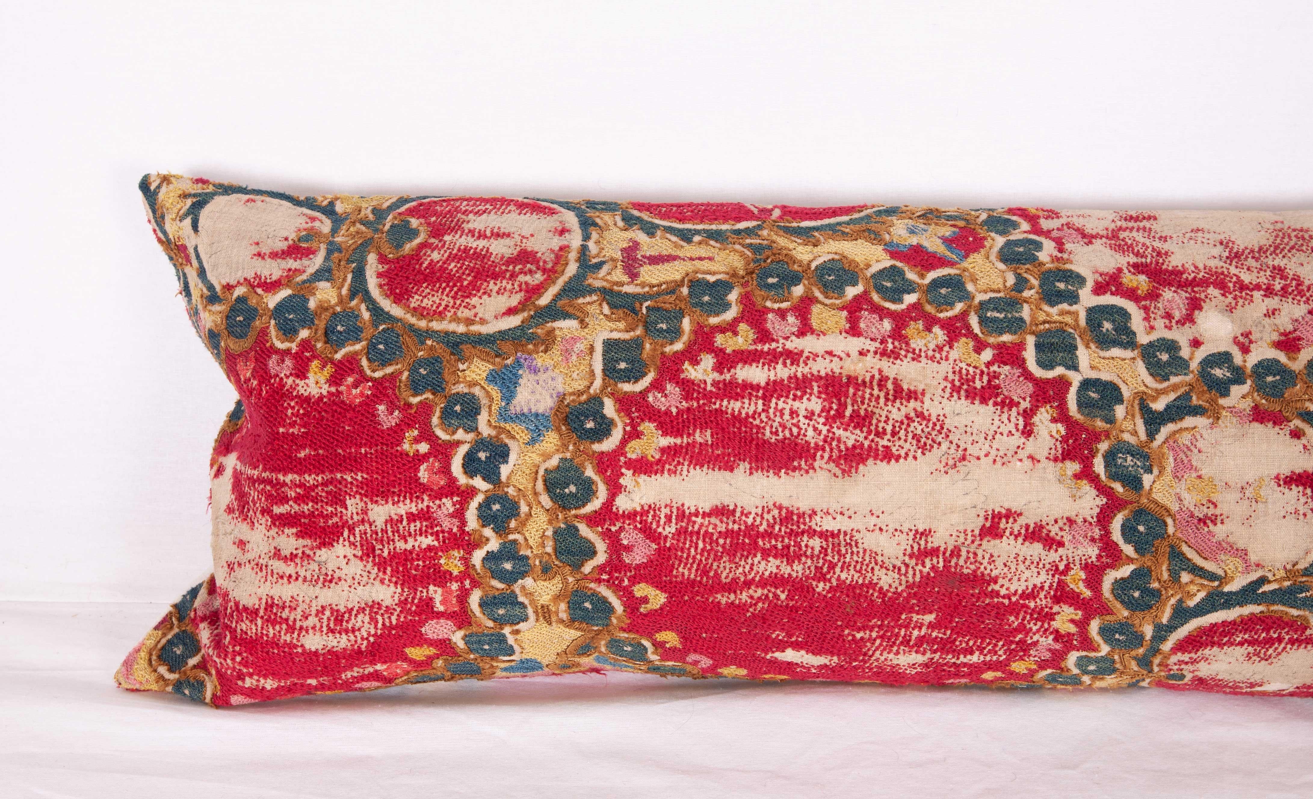 The pillow case is made from an antique Uzbek Suzani from Tashkent. It is silk embroidery on a handwoven cotton field. The backing is pure linen, and it does not come with an insert but bag made to the size in cotton to accommodate insert materials.