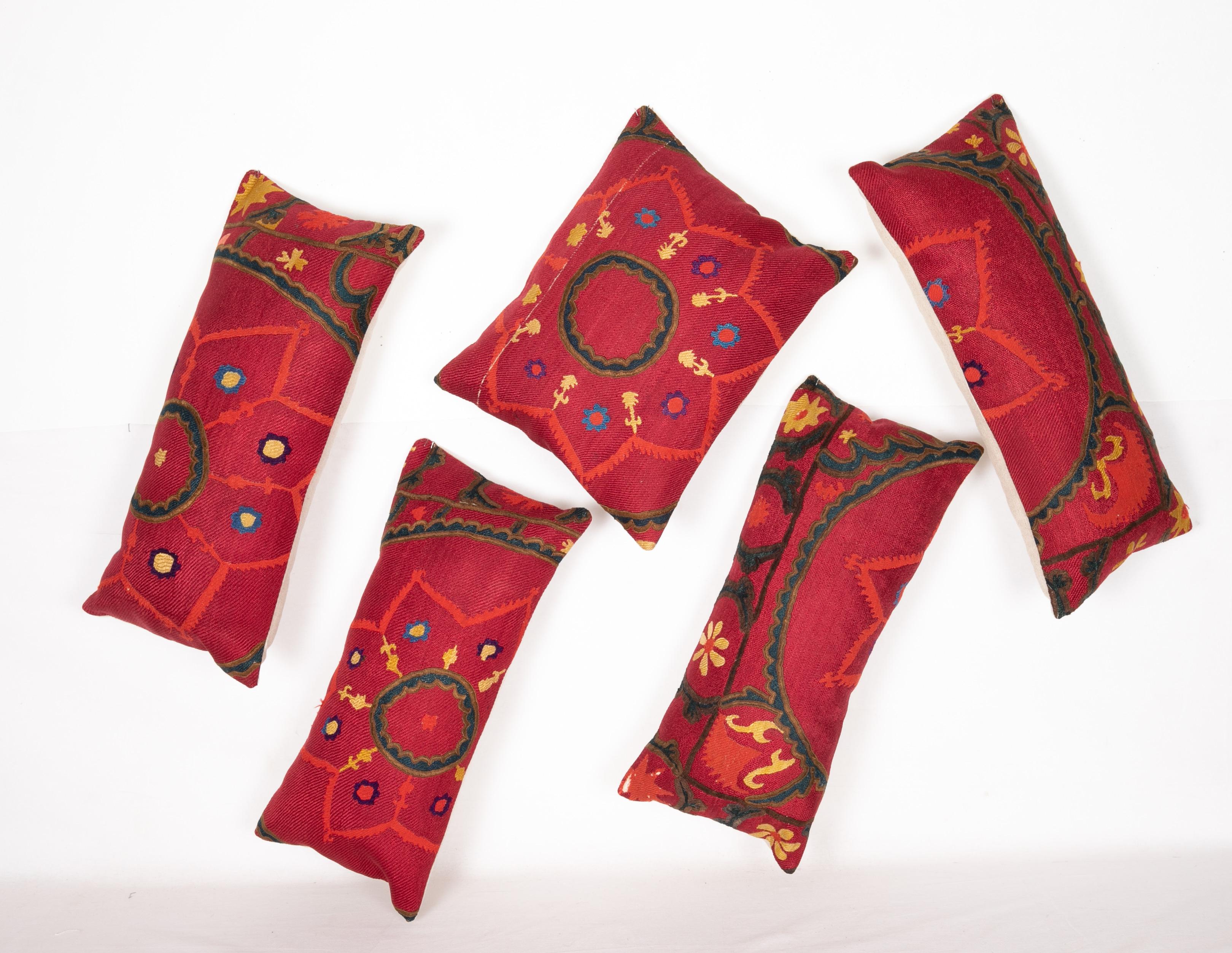 A group of 5 pillow cases fashioned from an antique Tashkent Suzani
Measures: 27 x 62 cm /10.6 x 24.4 in
27 x 64 cm/10.6 x 25.1 in
29 x 63 cm/11.4 x 24.8 in
28x 58 cm/11.0 x 22.8 in
38 x 46 cm /14.9 x 18.11 in.