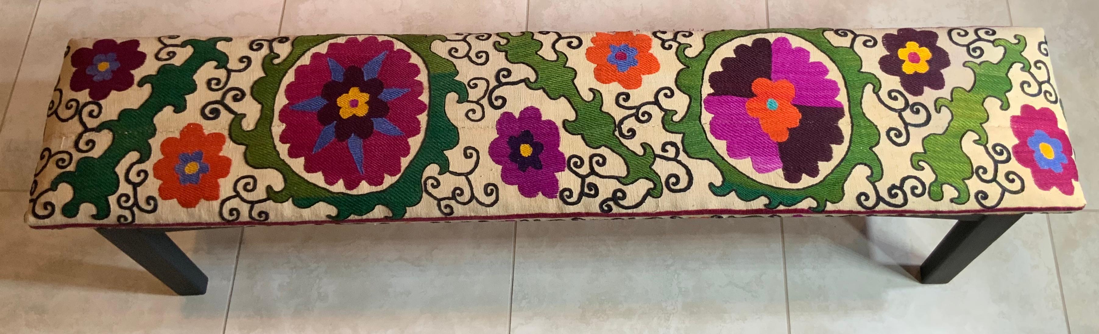 Exceptional sitting bench made of solid wood, no nails flat black painted, professionally upholstered with beautiful all hand embroidery 19 century Suzani textile.
What a fantastic object of art for use and display, structurally excellent.