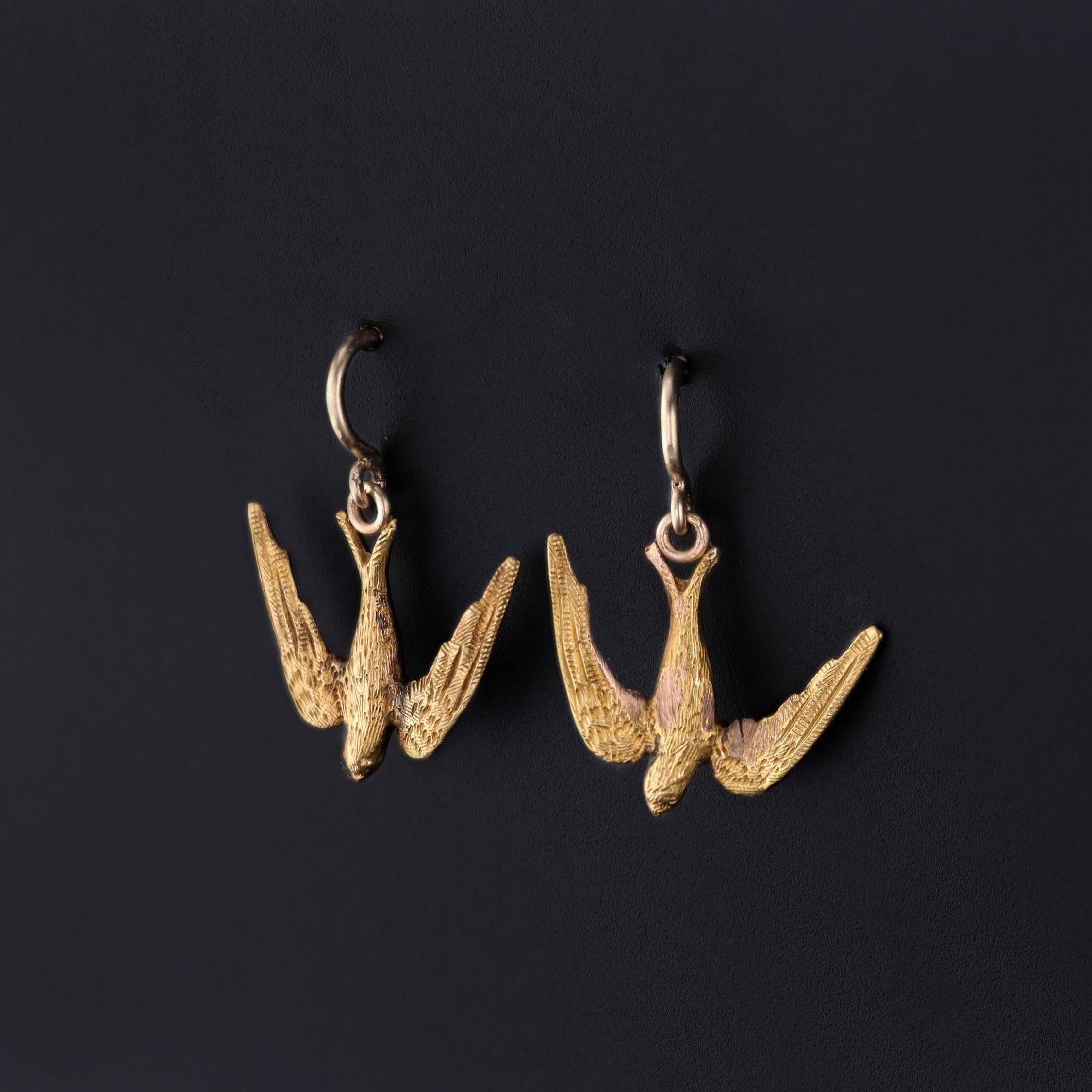 Antique Bird Earrings: These earrings feature 14k gold swallows. They were originally part of an antique brooch (circa 1890) that our jeweler transformed by adding 14k gold ear wires.

Each earring measures 0.75 inches from the top of the ear wire