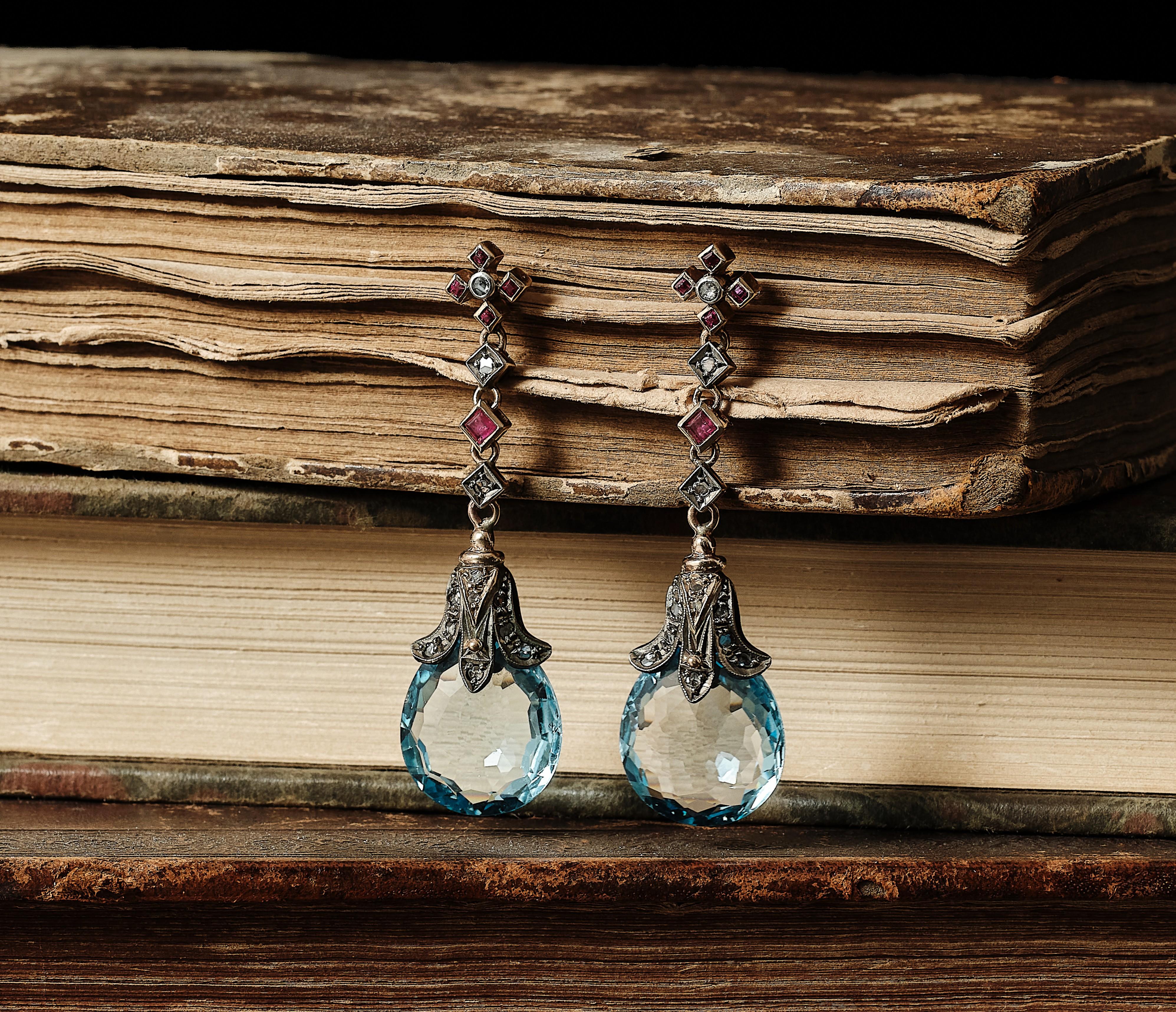 Briolette Cut Antique Arts and Craft topaz, rubies, diamond earings, made circa 1900. For Sale