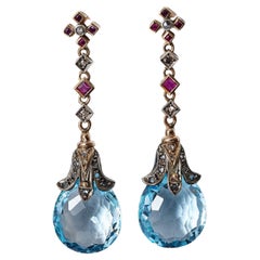 Antique Arts and Craft topaz, rubies, diamond earings, made circa 1900.