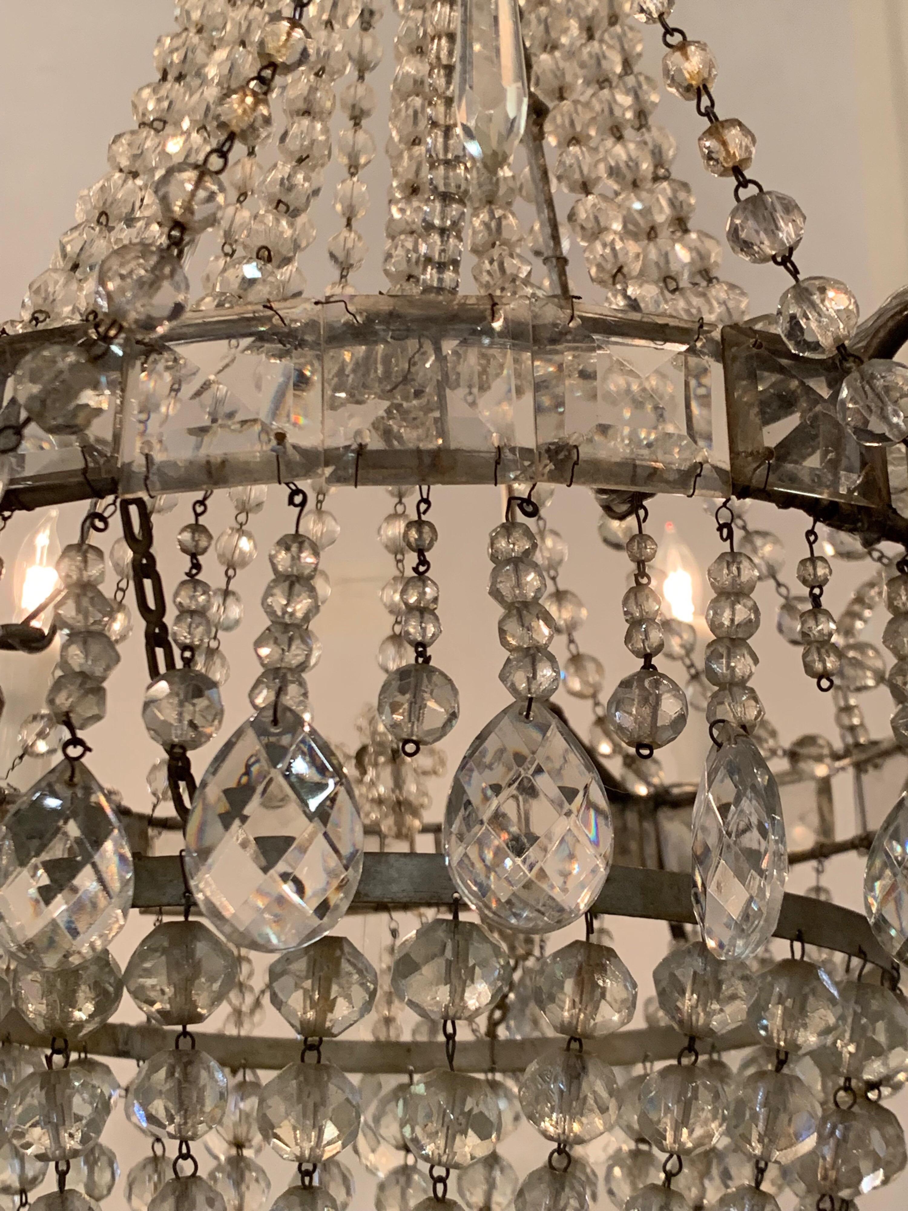 Very beautiful Swedish antique beaded crystal chandelier. Long strands of glistening crystals and dangling prisms make a stunning statement! Just cleaned and re-wired and ready to hang! Matching chain and canopy included.
