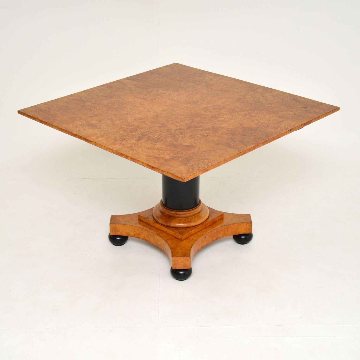 A stunning antique coffee / occasional table, this was made in Sweden and dates from around the 1840s period. It is beautifully made from burr birch and ebonised solid wood.

The square top is large and has the most exquisite color and grain