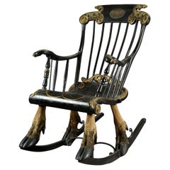 Antique Swedish Black and Golden Lacquered Rocking Armchair Mounted on Elk Legs