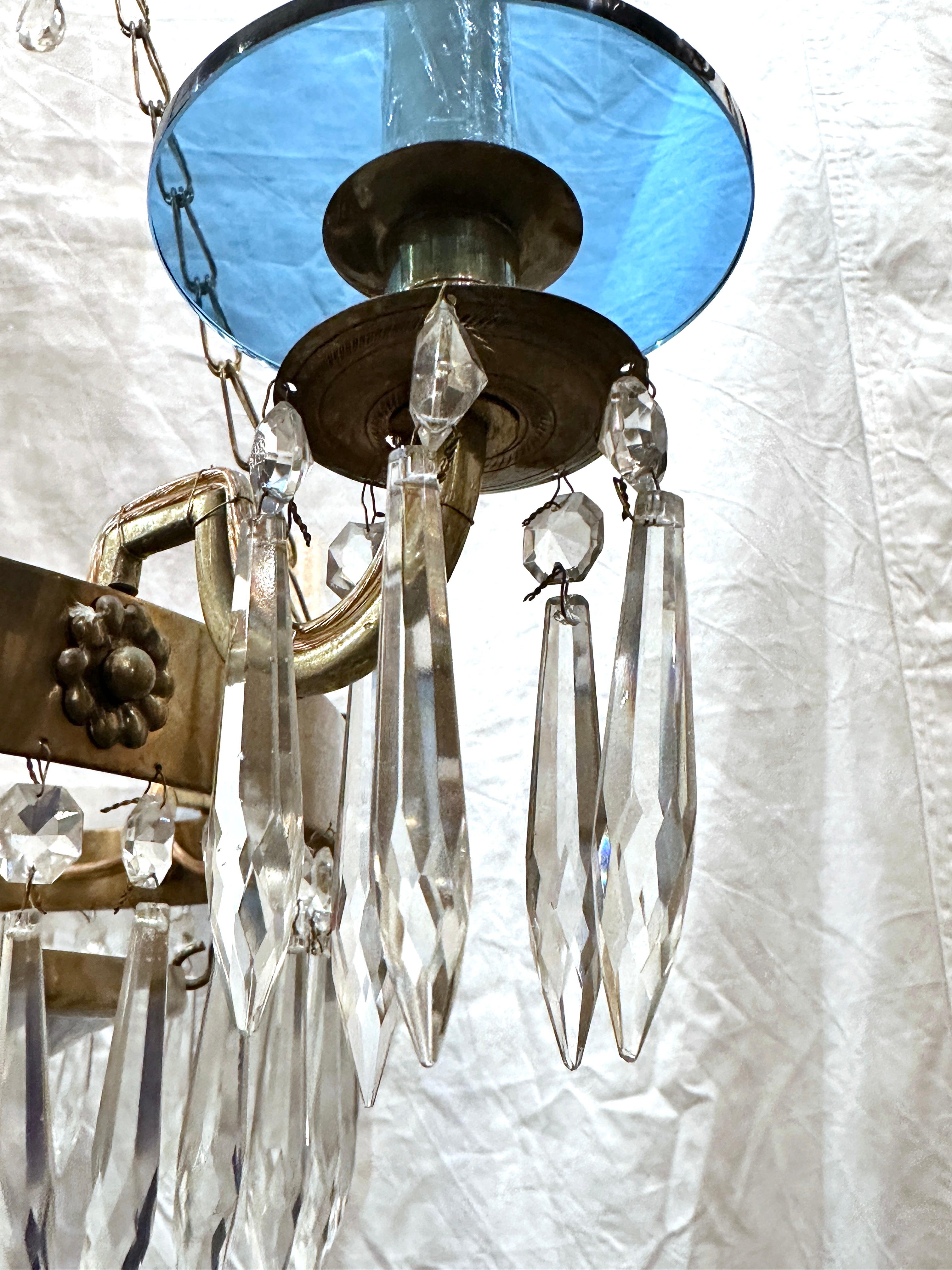 A circa 1900 Swedish chandelier with blue glass inset and crystal pendants.

Measurements:
Minimum drop: 30