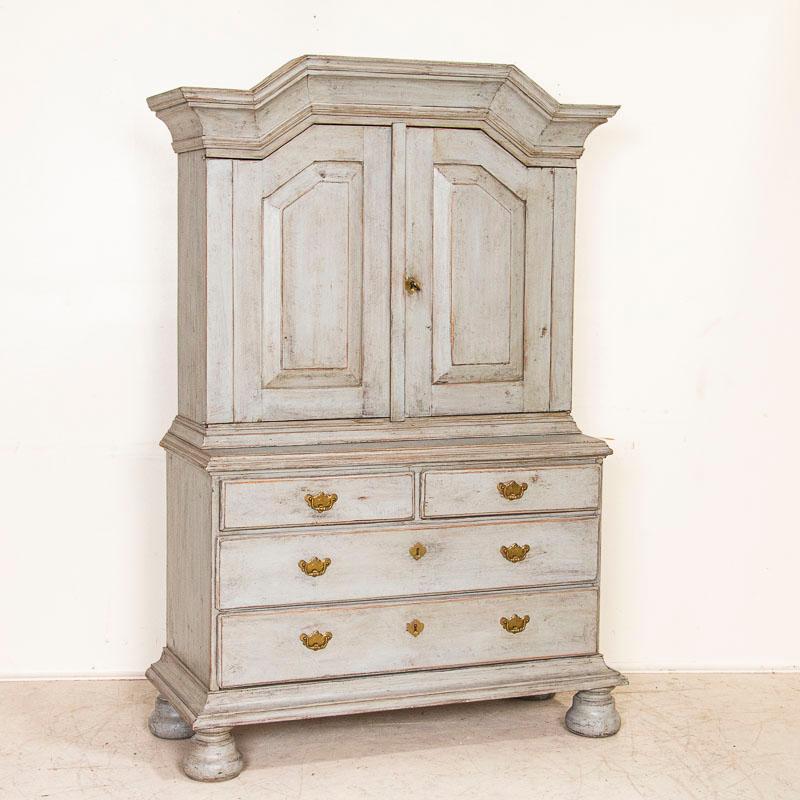 There is an understated elegance to this lovely cupboard which likely came from a Swedish country manor house. The natural pine has been given a (newer) blue painted finish, with soft undertones of gray. Please enlarge the photos to appreciate the