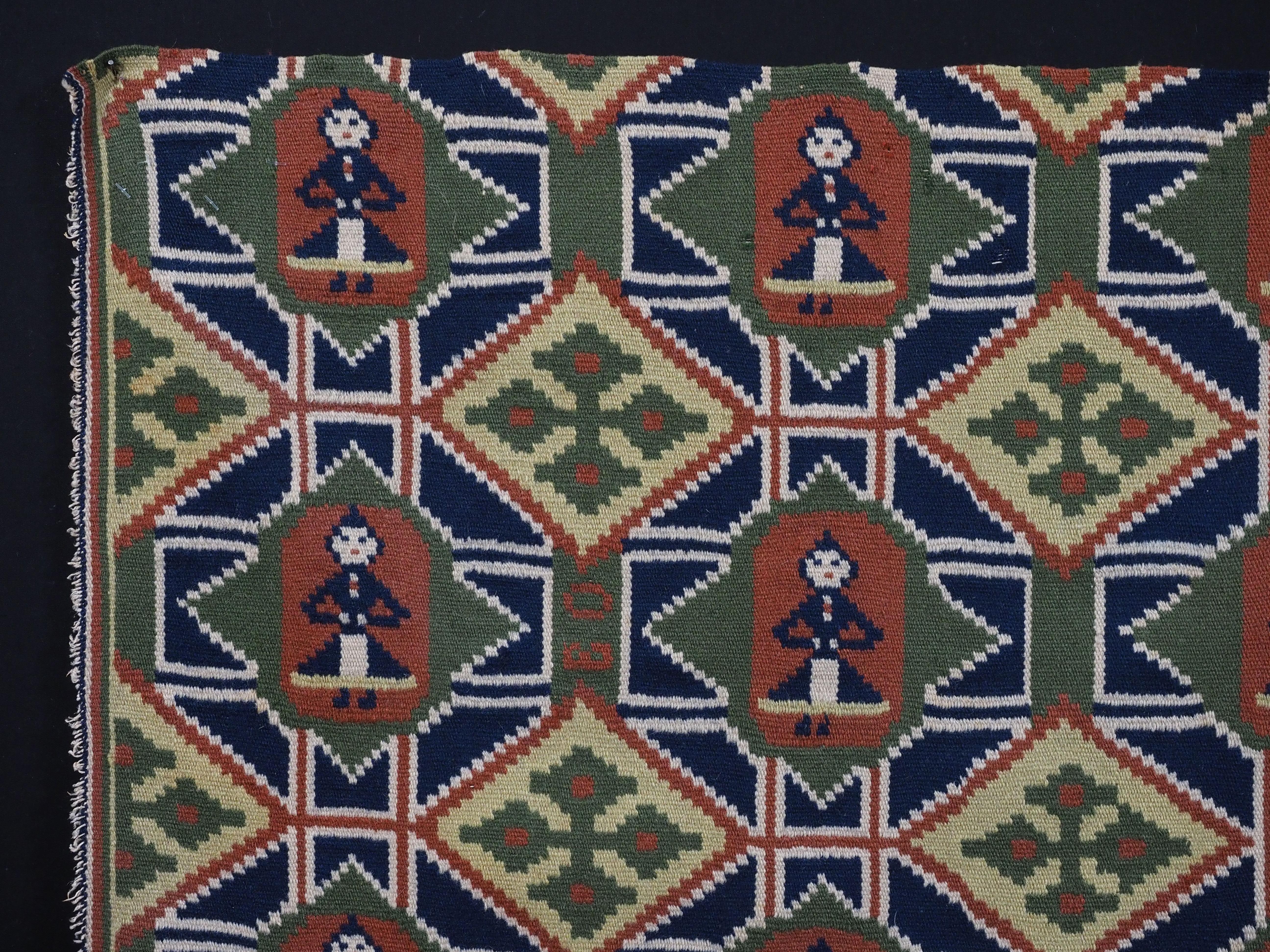 Size: 2ft 4in x 1ft 10in (71 x 56cm).

Antique Swedish carriage cushion cover face.

Mid 19th century.

This beautiful cushion cover face is woven in interlocked tapestry technique; the design is a diamond lattice containing nine ladies in