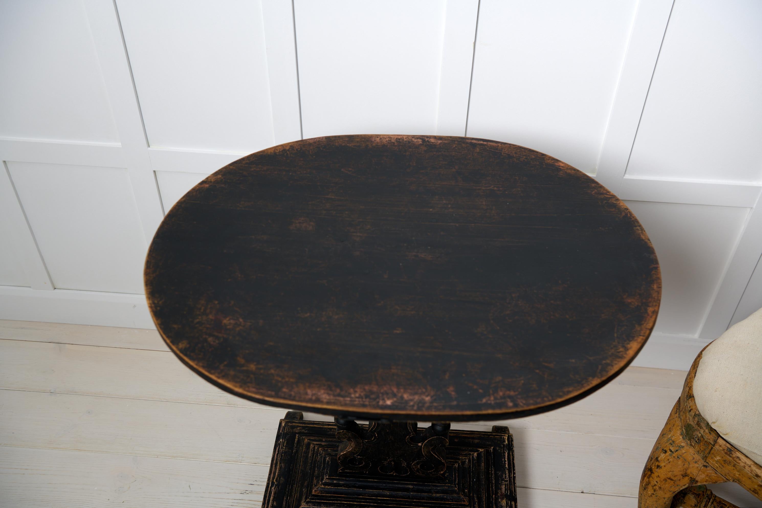 Pine Antique Swedish Center Table, Distressed Black Paint Oval Top and Ornate Base For Sale