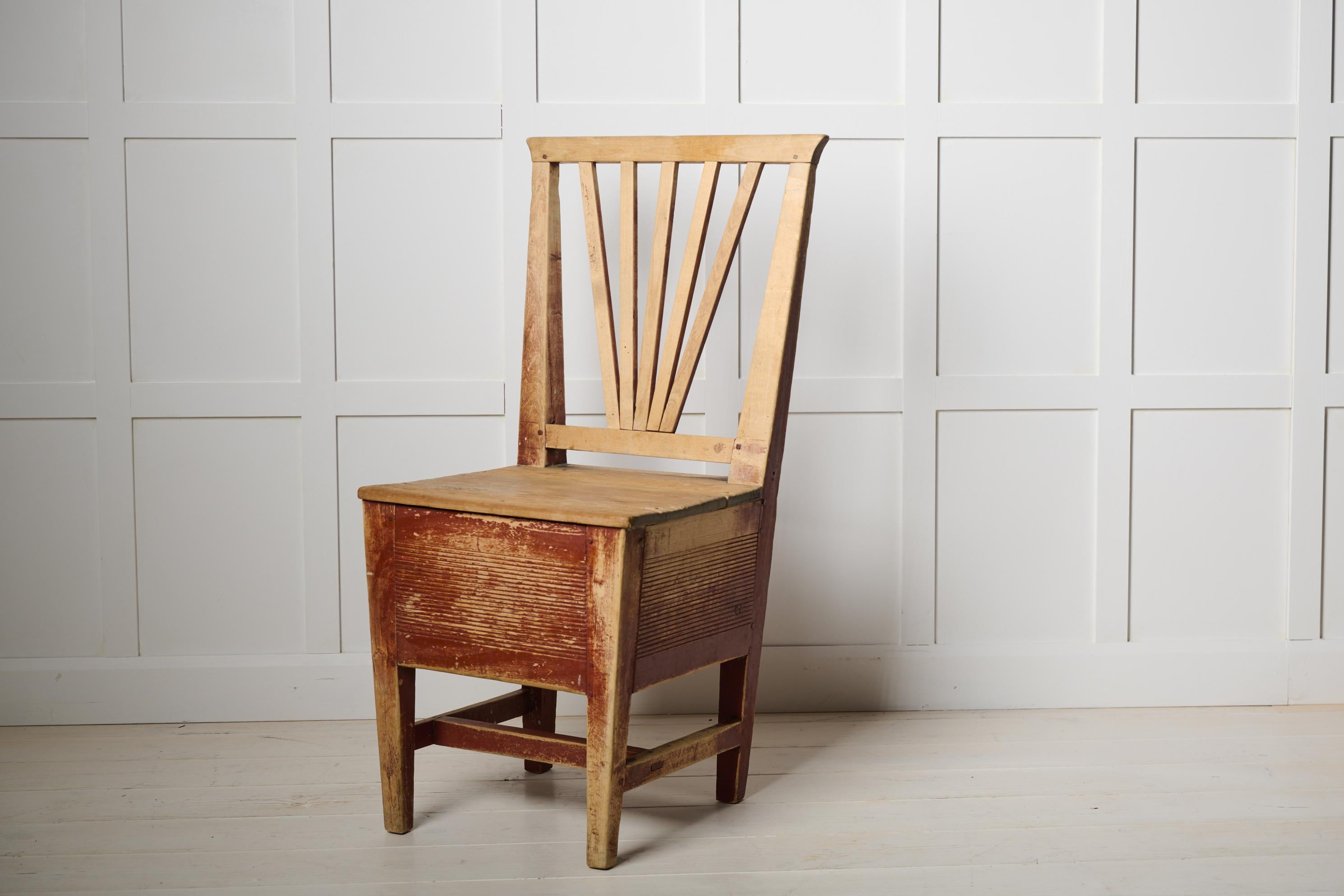 Swedish folk art chair, an antique so called höstol. Chairs like this would often stand in the hallway and during the winter hay or straw was stored in the drawer which was then used as isolation in shoes during the cold winter. Hence the name