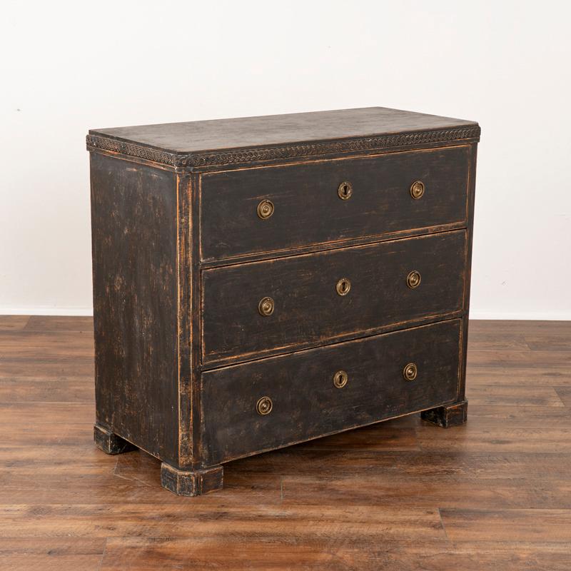 The simple lines that accent this charming pine chest of three drawers are reflective of its Swedish country styling. Note the gentle carving along the top and traditional vertical grooves along the sides. This lovely three drawer pine chest of