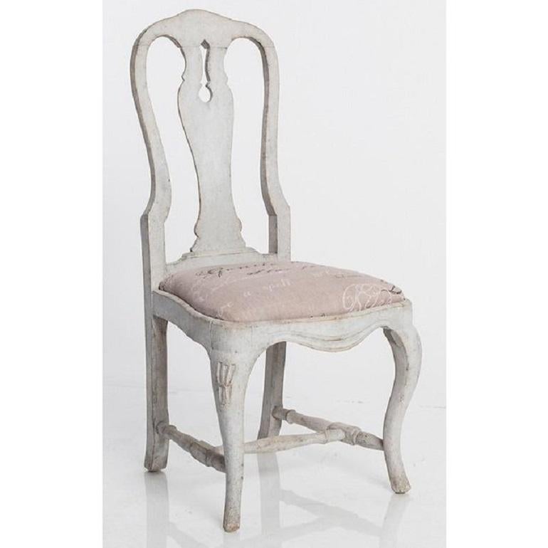Elegant set of Gustavian style dining chairs, made in Sweden in the 19th century. Classic Queen Anne style silhouette, decorated with graceful curved backrest, supported by cabriole legs that are joined by turned stretchers. Newly restored cushioned