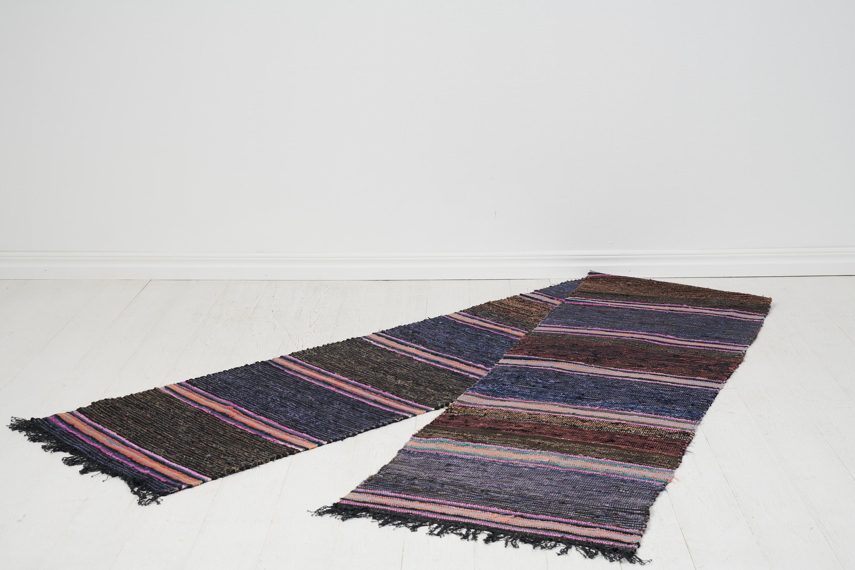 Antique Swedish hand-woven rug in folk art from the turn of the century 1800 to 1900s. The rug is from Delsbo in Hälsingland in Sweden and has been on the same farm since it was made. These rugs, also known as rag rugs, are made from multiple