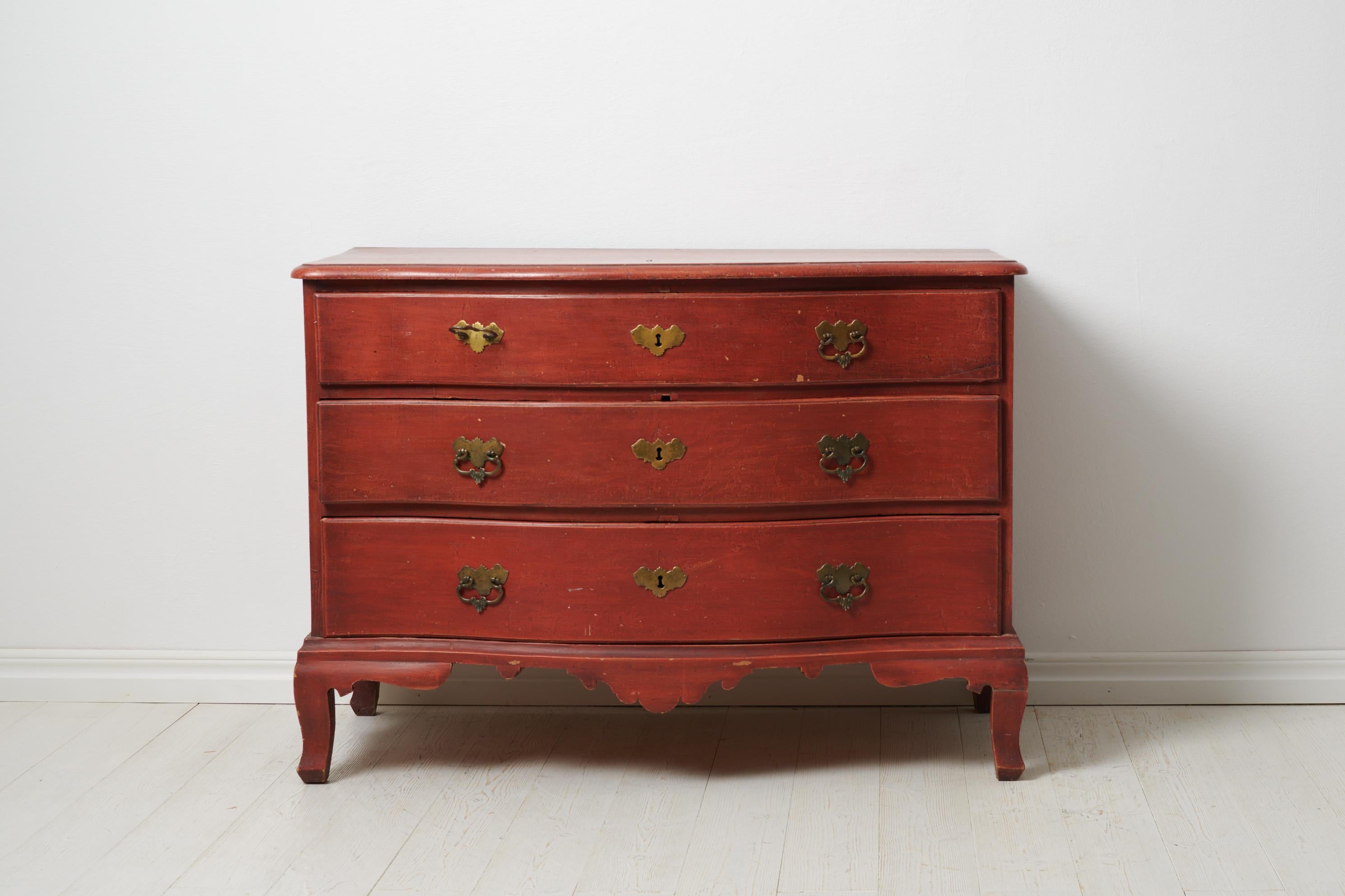 Swedish antique baroque bureau from the late 1700s in Sweden. Unveil the timeless charm of this Swedish antique baroque bureau, boasting a gracefully curved front and table top—a true gem from the late 1700s crafted in solid pine. Witness history