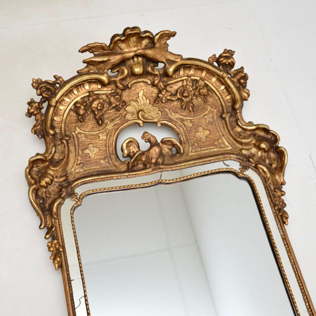 A large and absolutely stunning, extremely impressive antique Swedish Gustavian gilt wood mirror. This was recently imported from Sweden, we would date it to around the 1820-1840 period.

The quality is outstanding, this is a rare and very beautiful