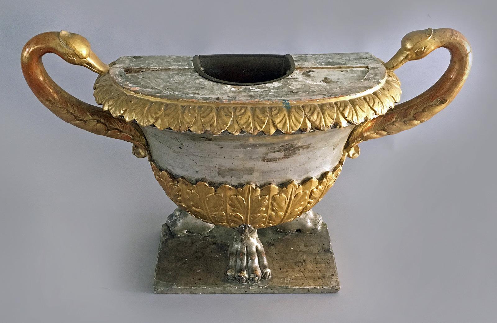 Antique Swedish Gustavian vase-shaped jardinière with large swan neck handles. The top edge is carved with a border of gilded acanthus leaves, above a silvered body, above carved and gilded rows of vertical acanthus leaves, ending with boldly carved