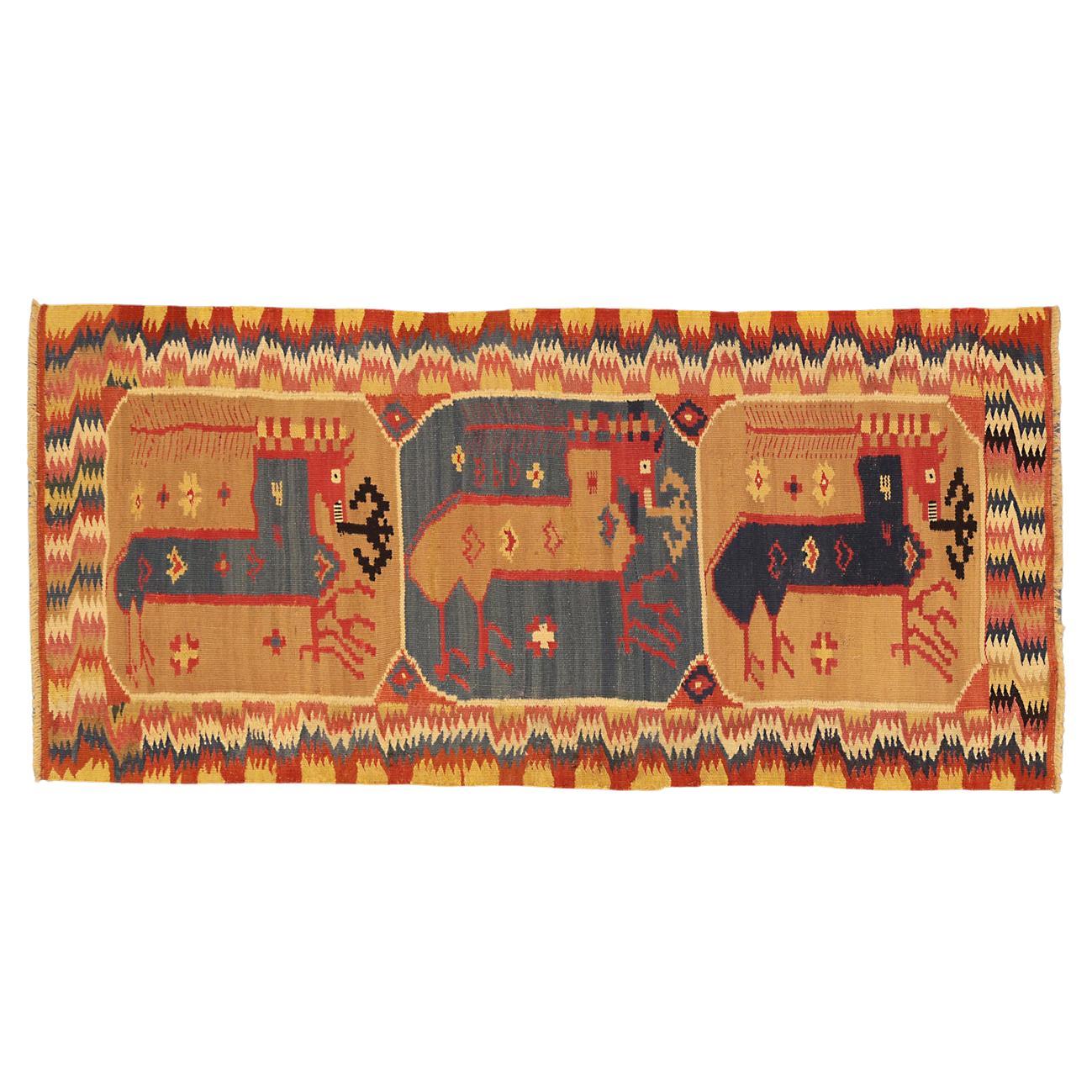 This is an antique European Swedish textile woven during the 19th century and measures 97 x 47CM in size. It has a horizontal format with three enclosed horse motifs set on alternating beige and blue background colors. This textile has been woven