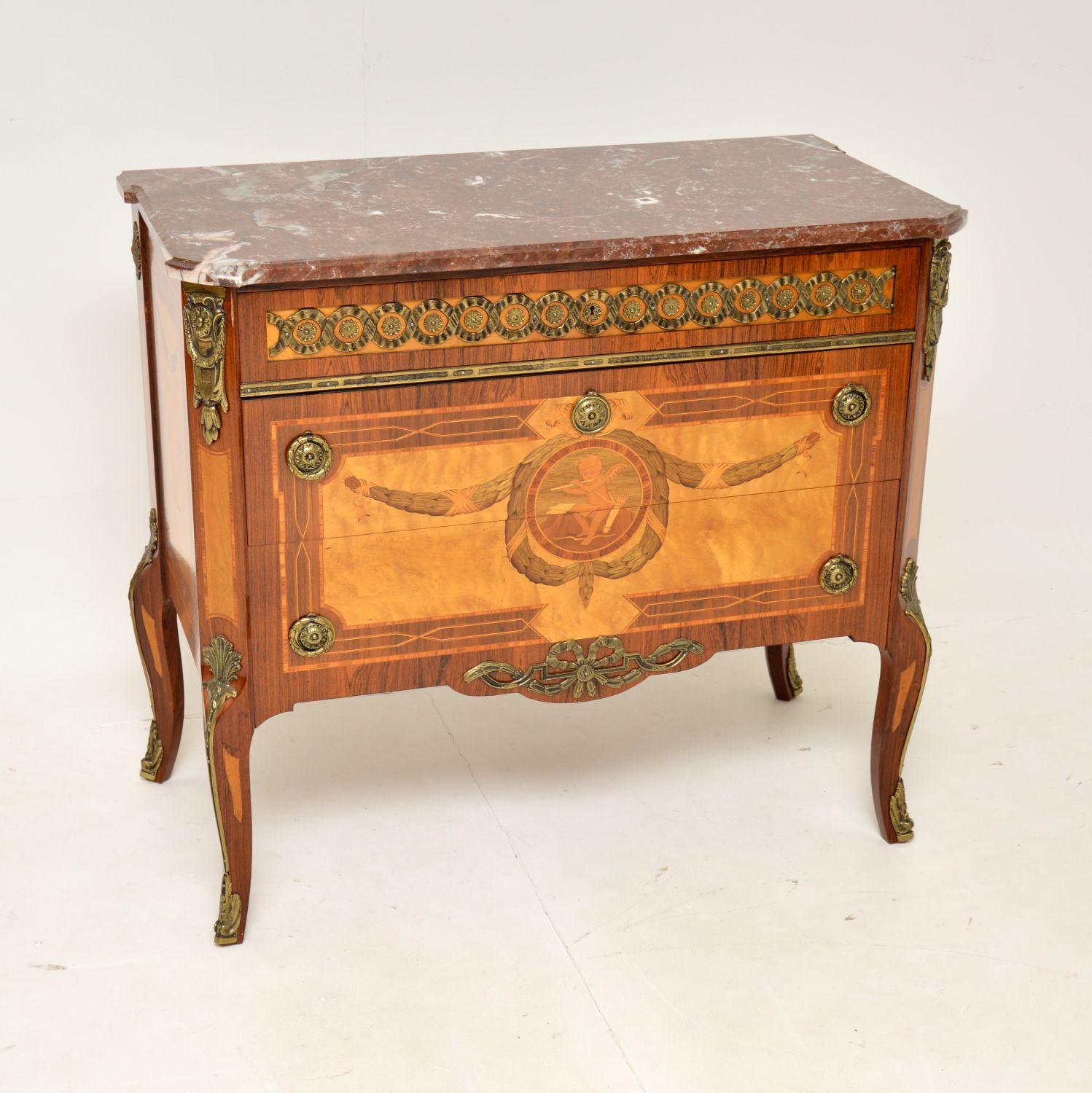 A stunning antique Swedish marble top commode, with exquisite marquetry inlay. This was recently imported from Sweden, it dates from around the 1930’s.

The quality is superb, with absolutely gorgeous inlaid designs and contrasting woods. There