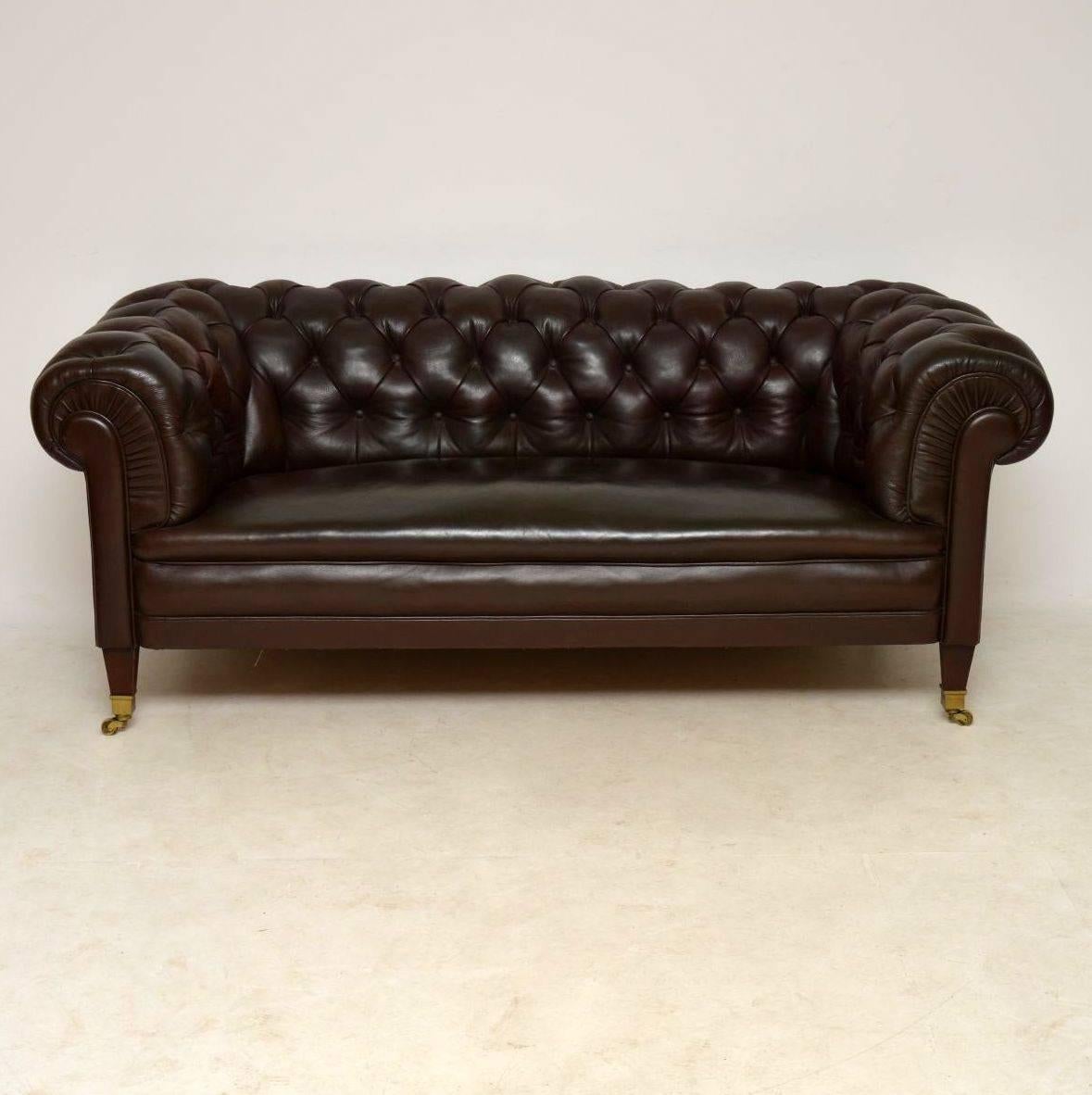 Antique Swedish leather Chesterfield sofa with a deep buttoned back and arms, sitting on mahogany feet with brass capped casters. It’s in good original condition and dates from around the 1910 period. This Chesterfield is of extremely high quality