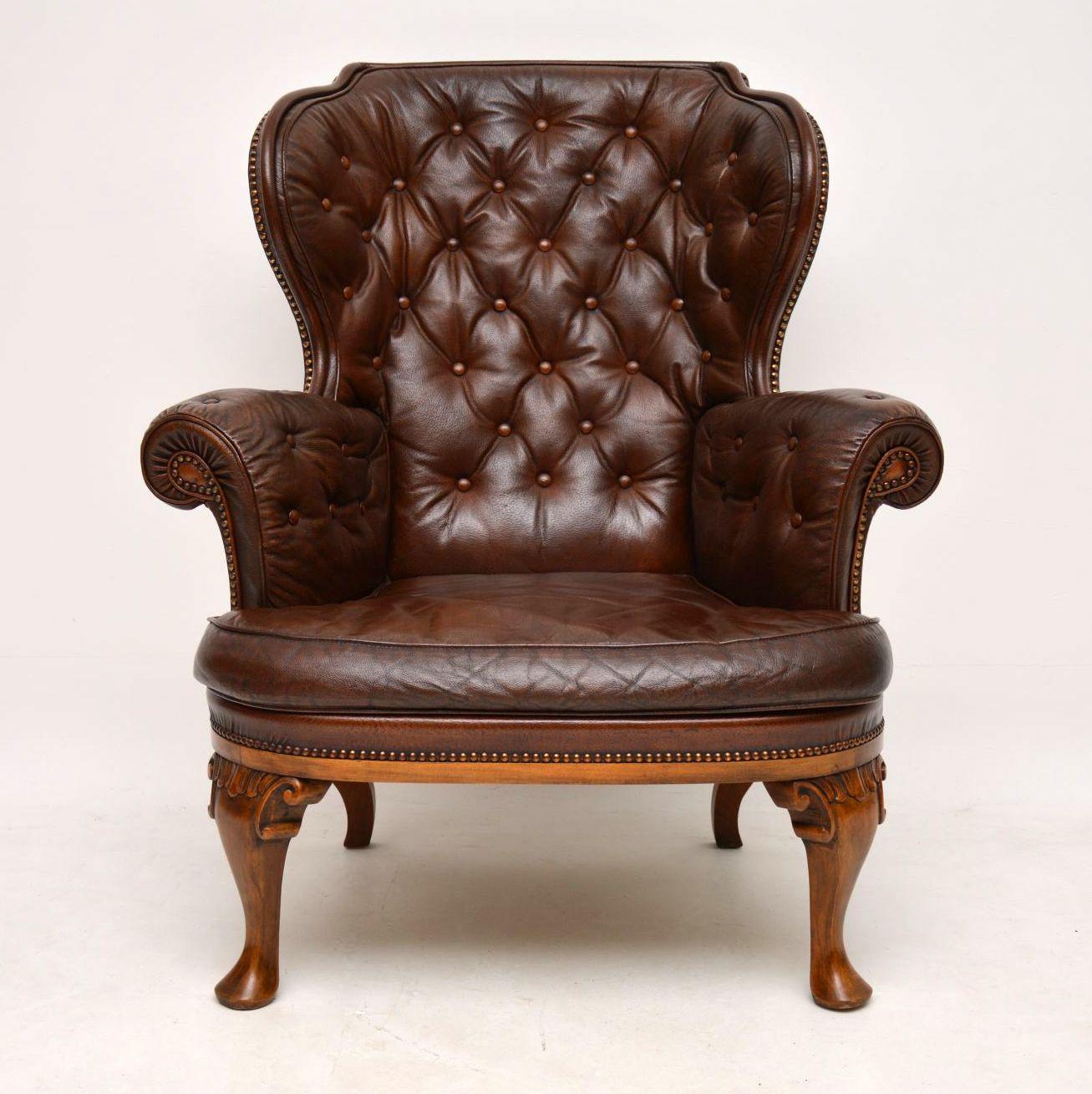 This antique Swedish leather wing armchair has a fabulous shape and is very comfortable, helped by the sloping back and head support. The inside leather is deep buttoned and it has a loose cushion. The leather is naturally aged and I particularly