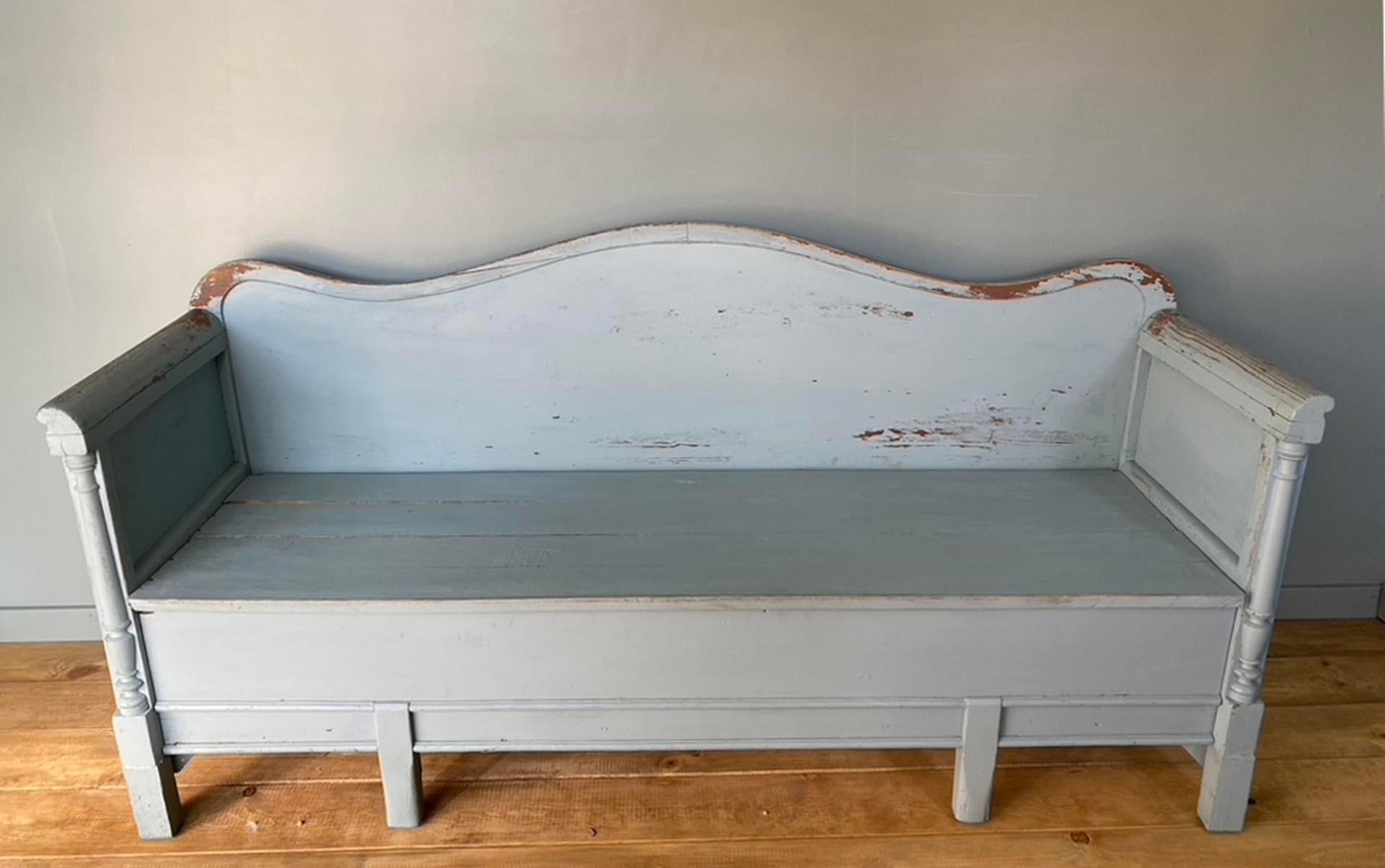 Turn of the 19th - 20th century Swedish lift top bench or bed in a light blue color. These were placed in farm house kitchens and typically the milkmaid's bed, thus the name 