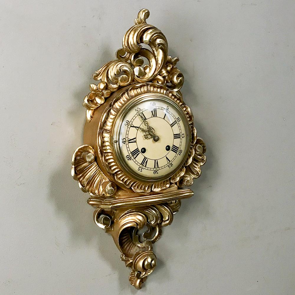 Antique Swedish Louis XV giltwood wall clock, or cartel as they are known in Europe is the perfect way to decorate the wall in timeless fashion for generations to come! hand carved to perfection in the Rococo manner then given a gilded finish, it