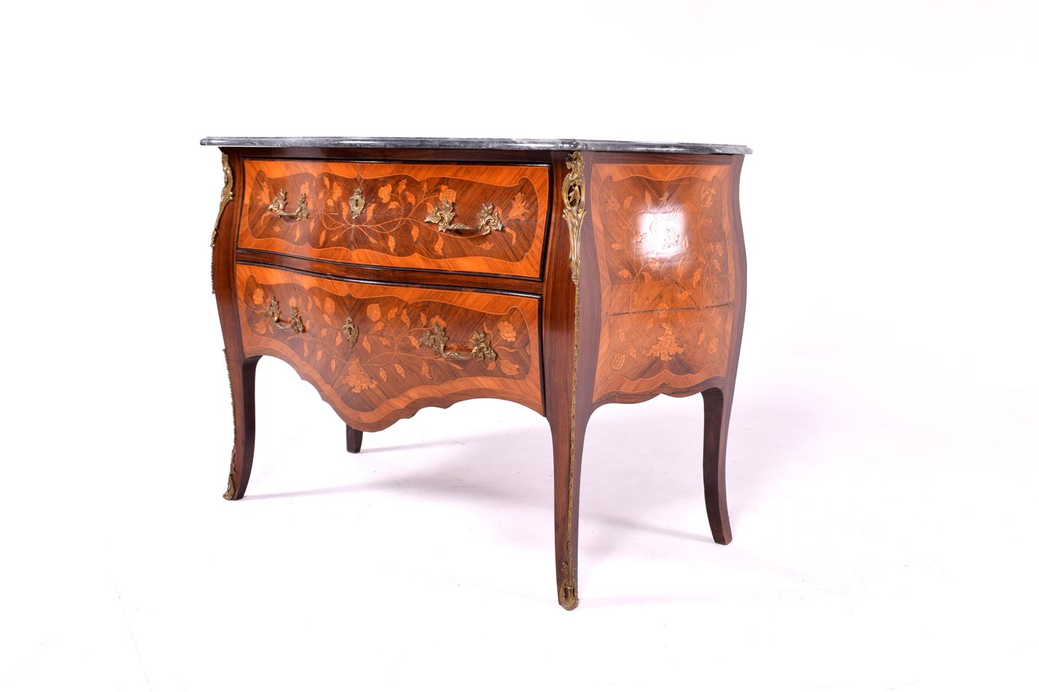 A fine quality early 20th century Swedish marble topped and bronze mounted marquetry bombe commode. This stunning decorative and richly hued commode is accented with a magnificent marble top and original bronze mounts and features rosewood and