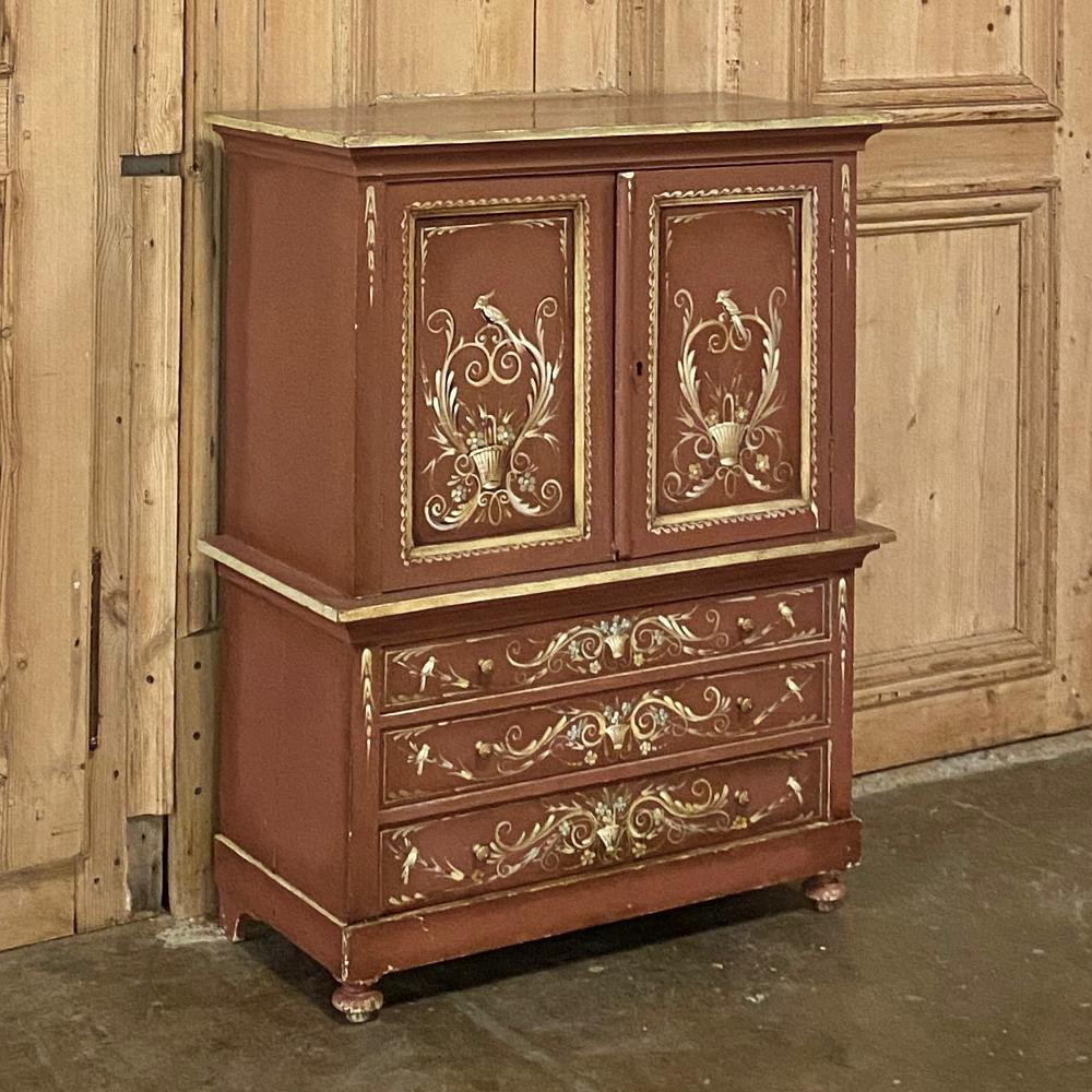 Antique Swedish painted commode ~ cabinet is a delightful piece to brighten up any room! With a pastel brick red background, the artisans hand painted birds, florals and foliates on the facades of the upper tier of two cabinet doors with painted
