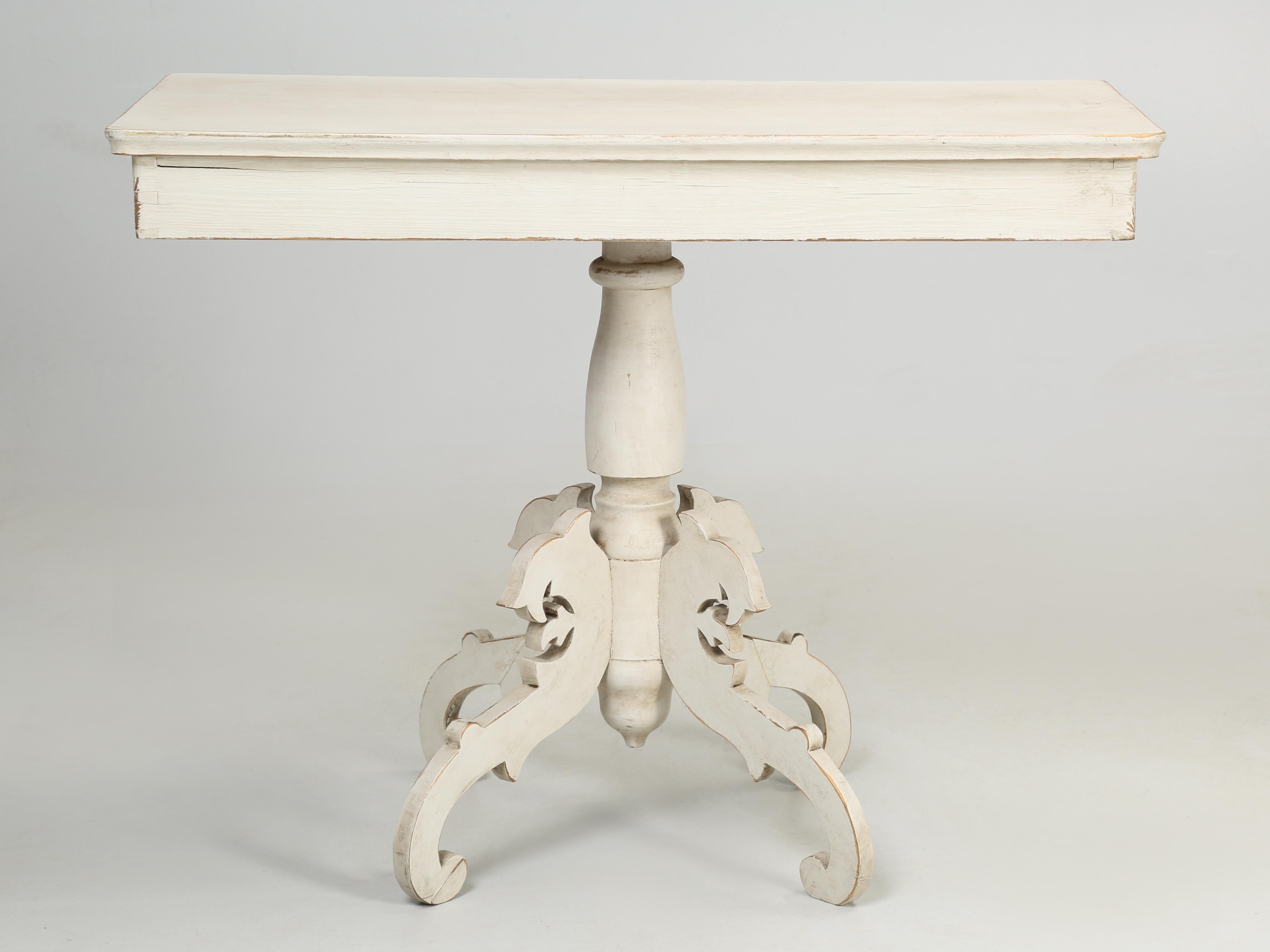 Small pedestal table that we believe came from Sweden. The paint is certainly much newer than the table, which appears to be constructed in the first half of the last century, while the paint was in the second half. This small Swedish table has a